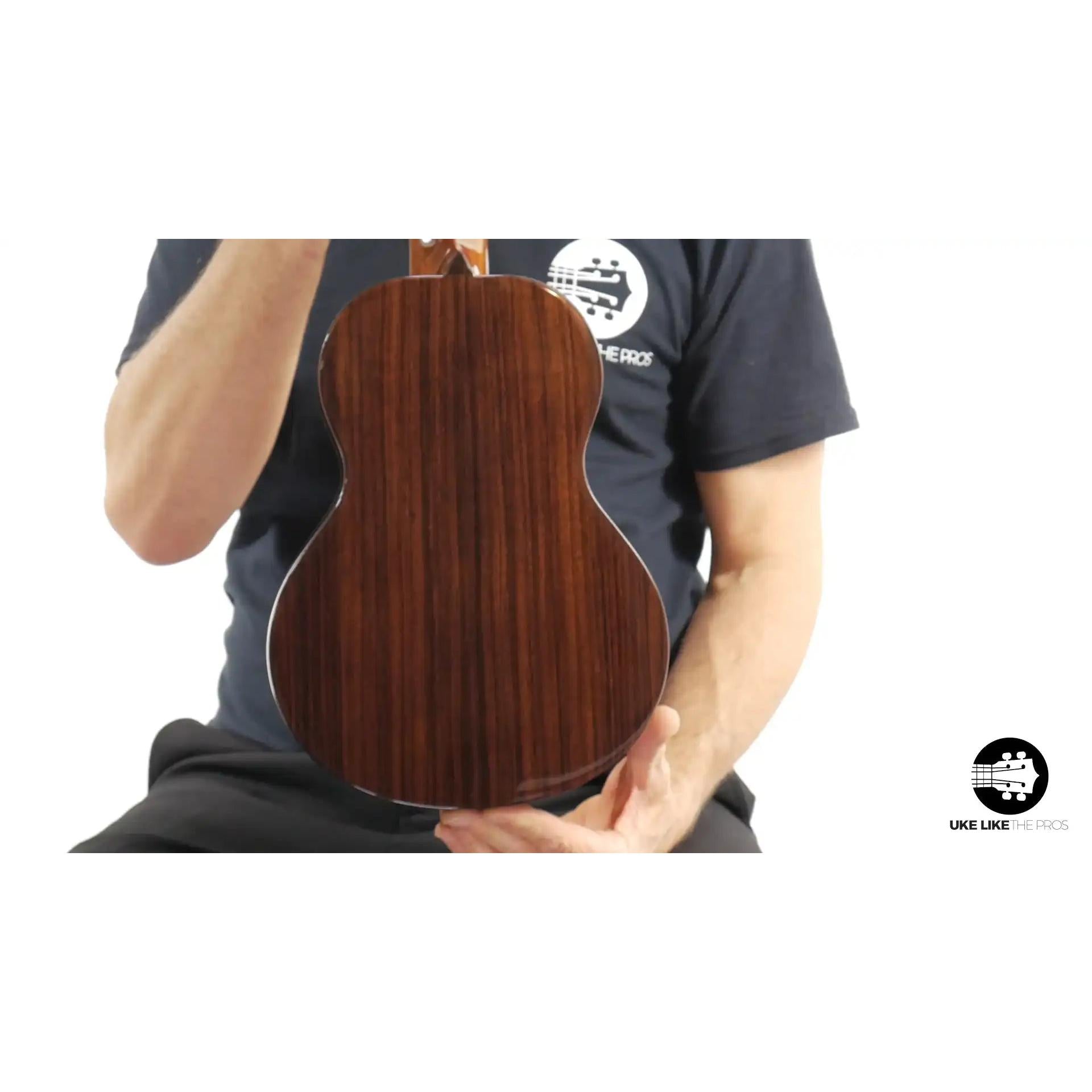 Rebel Quark ukulele with rich dark wood back, showcased at Terry Carter Music Store.
