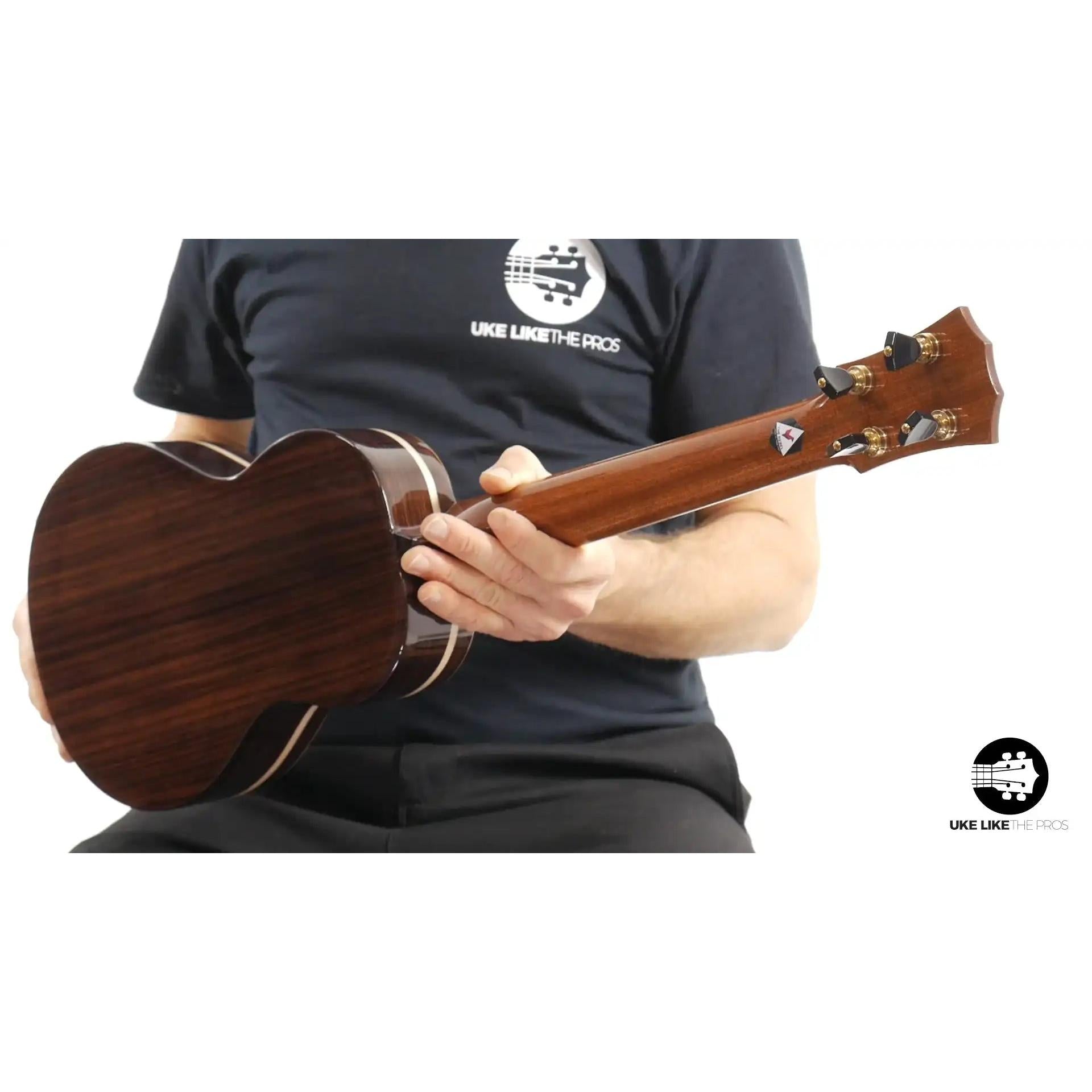 Back view of Rebel Quark ukulele with gloss dark wood finish, showcased at Terry Carter Music Store.