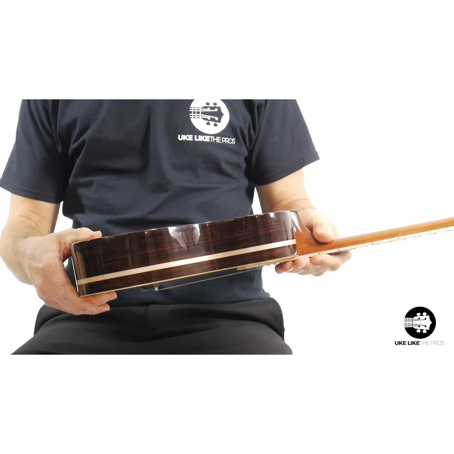 Rebel Quark ukulele side view with dark wood body, featured at Terry Carter Music Store.
