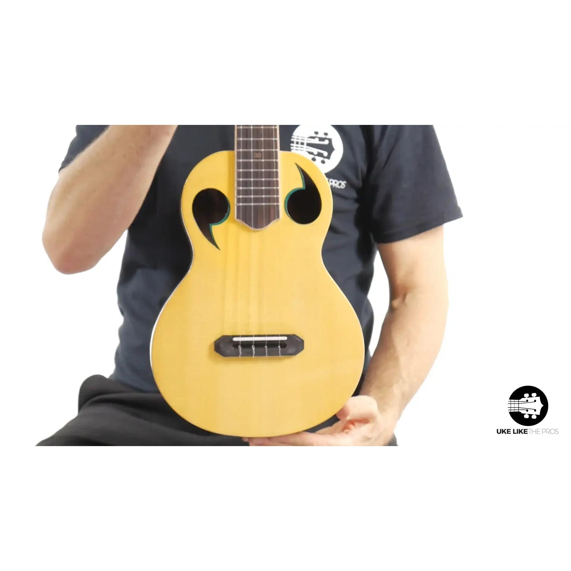 Rebel Quark ukulele with unique sound holes and natural wood top at Terry Carter Music Store