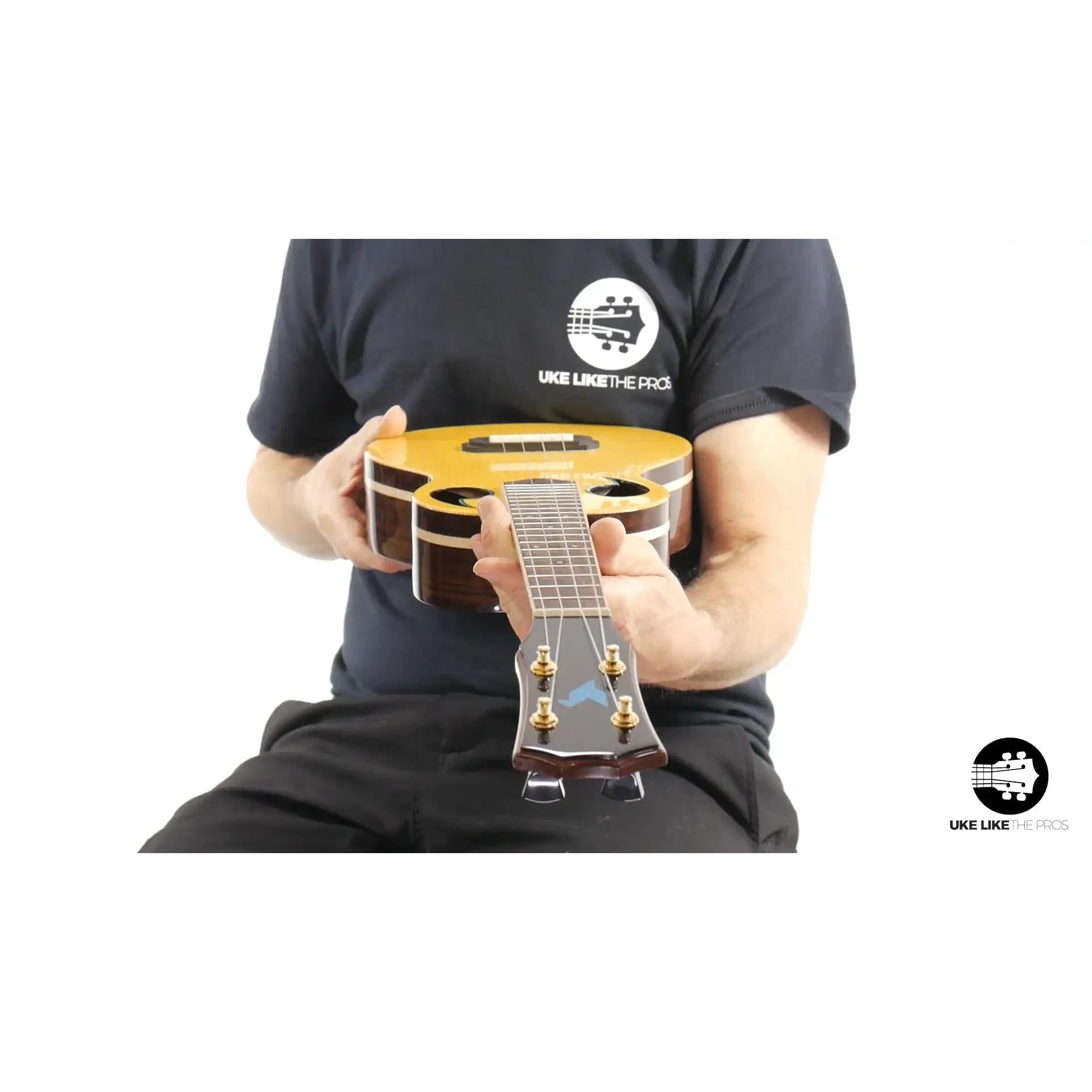 Rebel Quark Hitman B ukulele with natural finish, wood grain body, at Terry Carter Music Store
