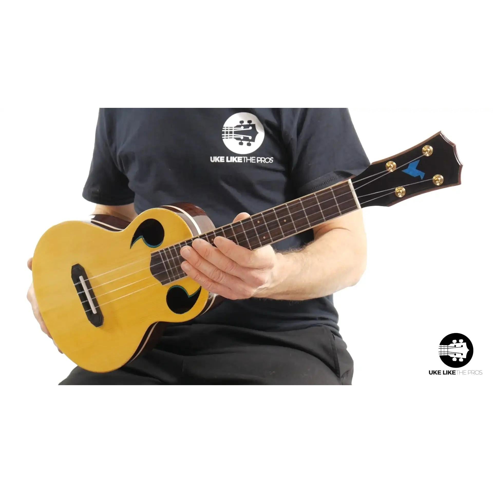 Rebel Quark ukulele headstock and body close-up with natural wood finish at Terry Carter Music Store
