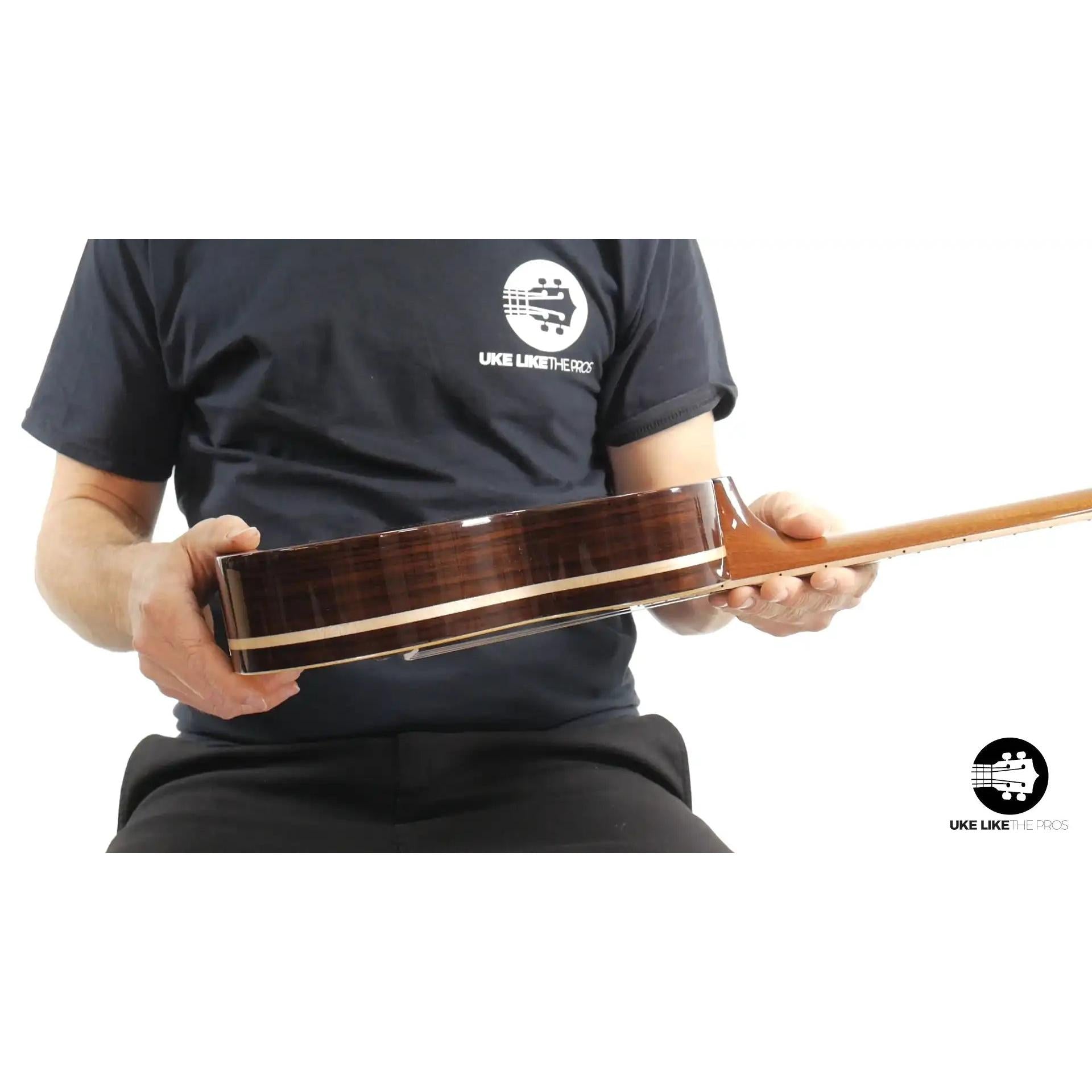 Rebel Quark side view showcasing rich wood grain ukulele at Terry Carter Music Store