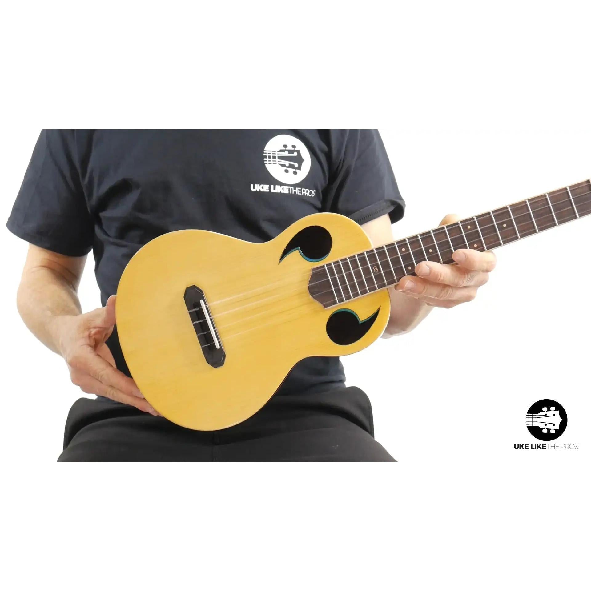 Rebel Quark ukulele with unique sound holes, natural wood finish, Terry Carter Music Store