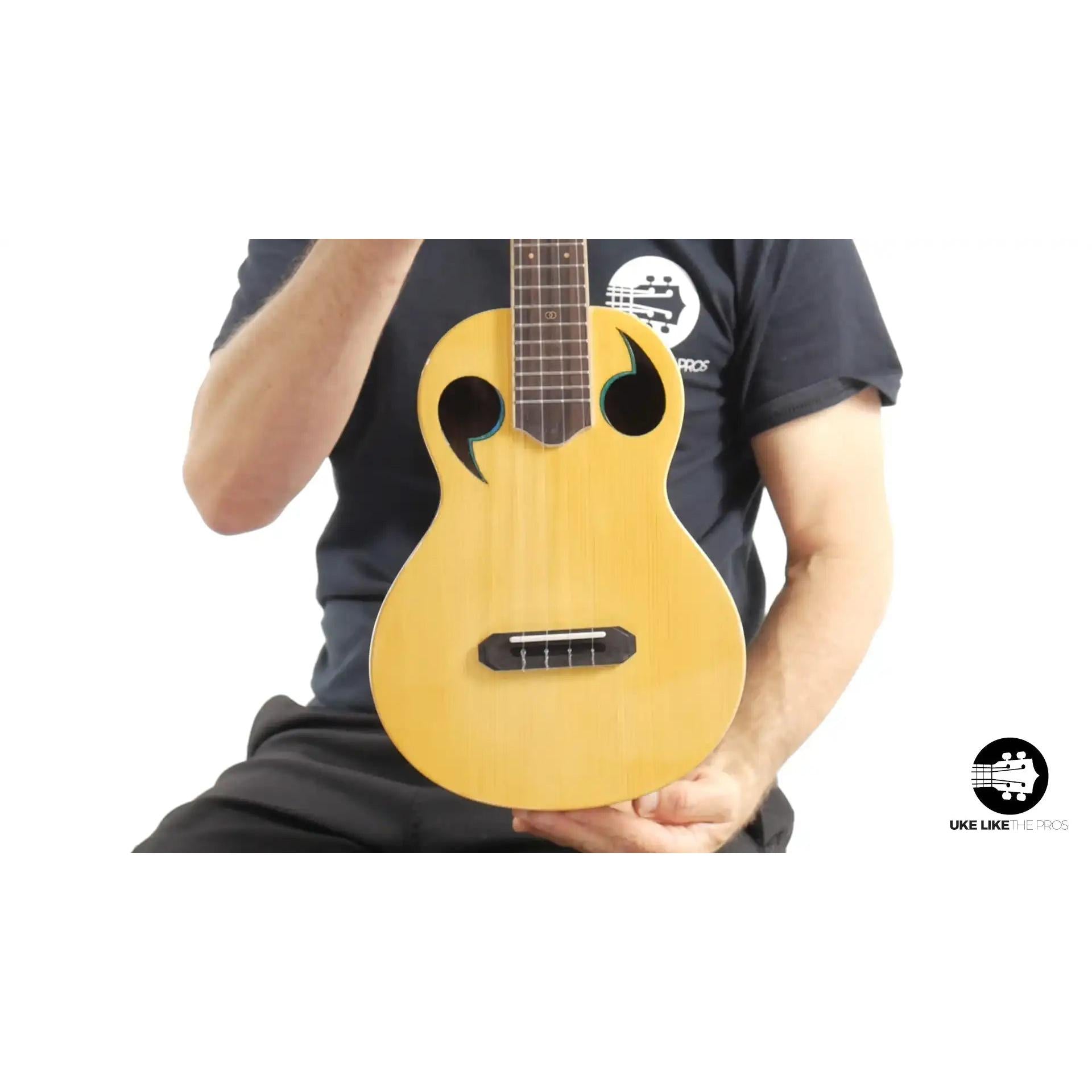 Rebel Quark ukulele with unique sound holes and light wood, Terry Carter Music Store