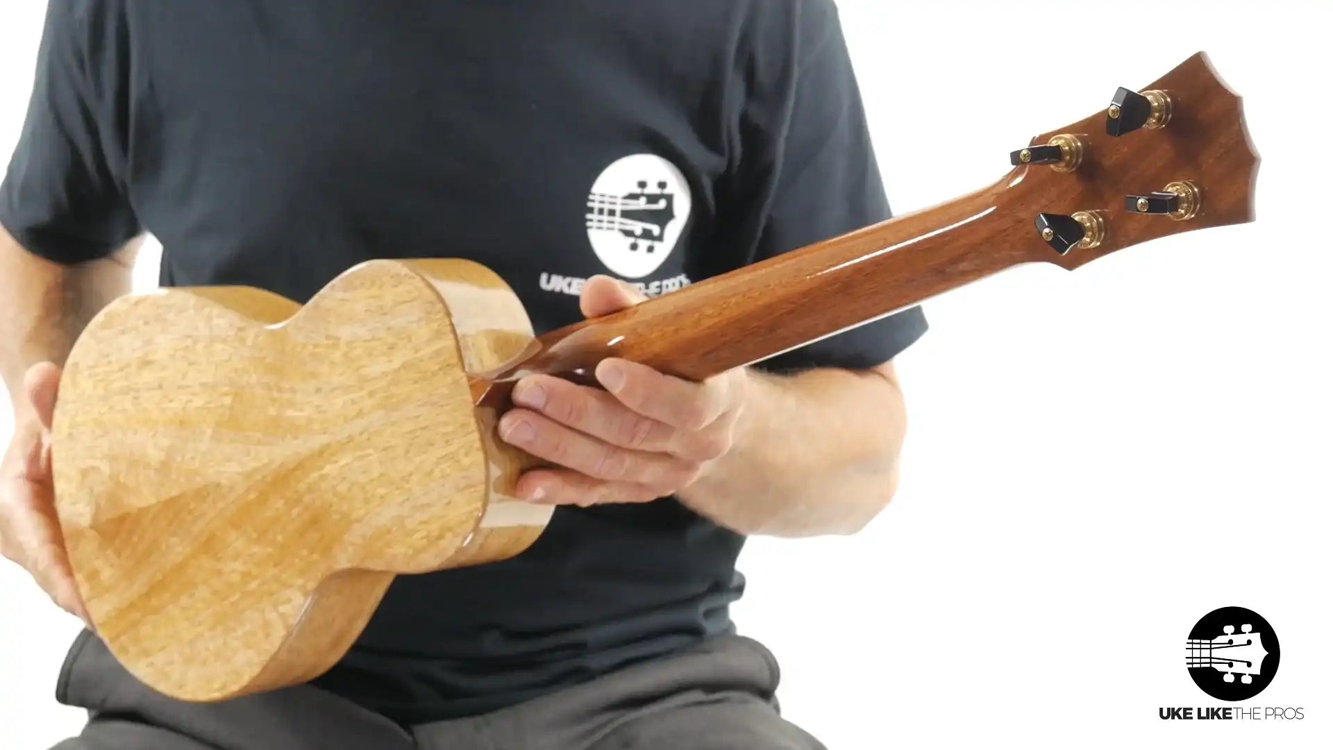 Back of a natural wood ukulele with gloss finish, shown at Terry Carter Music Store