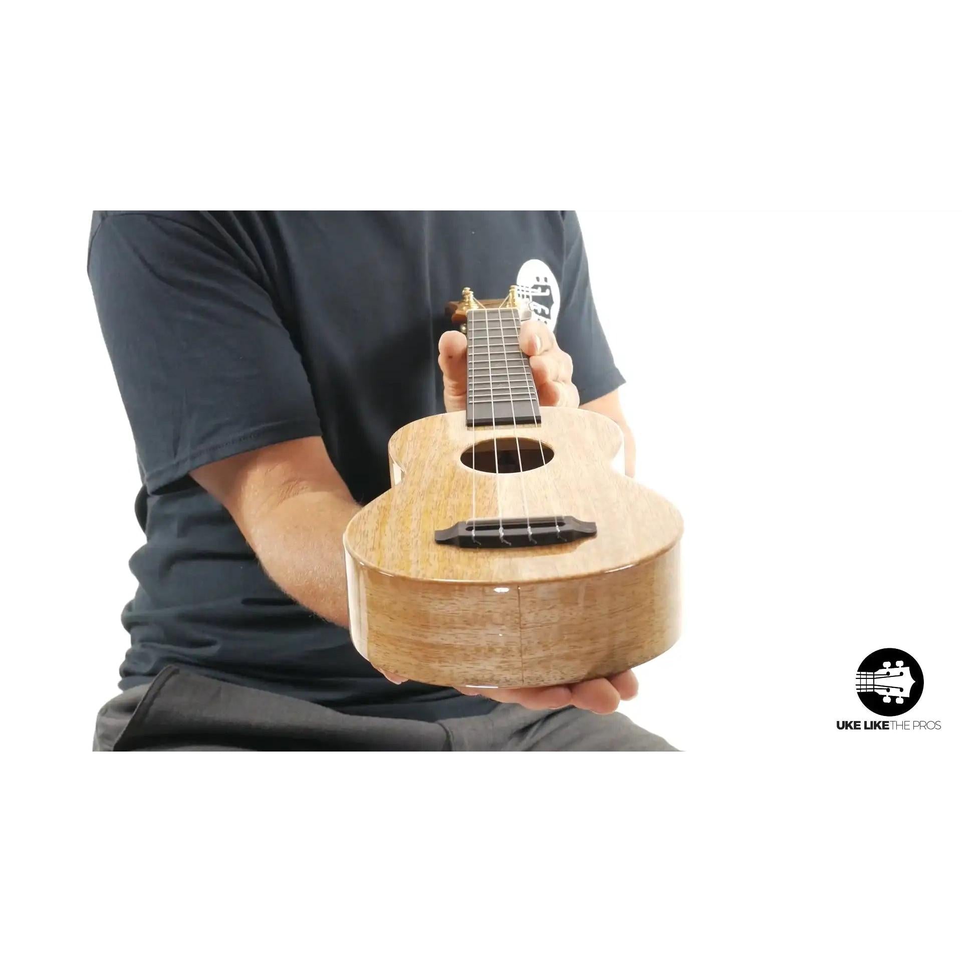 Little Giant soprano ukulele with natural wood finish held in hand, Terry Carter Music Store