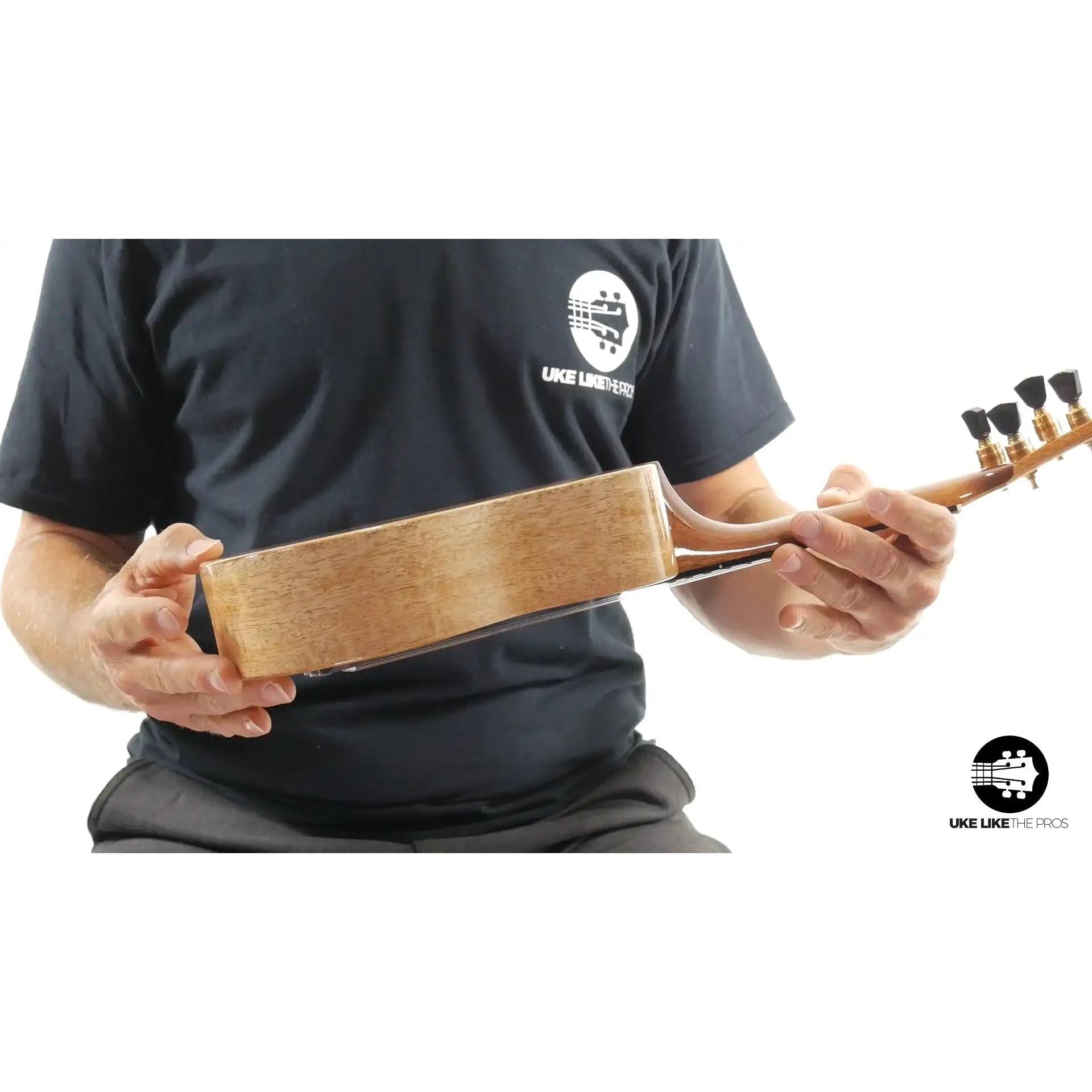 Side view of Little Giant ukulele with natural wood finish at Terry Carter Music Store