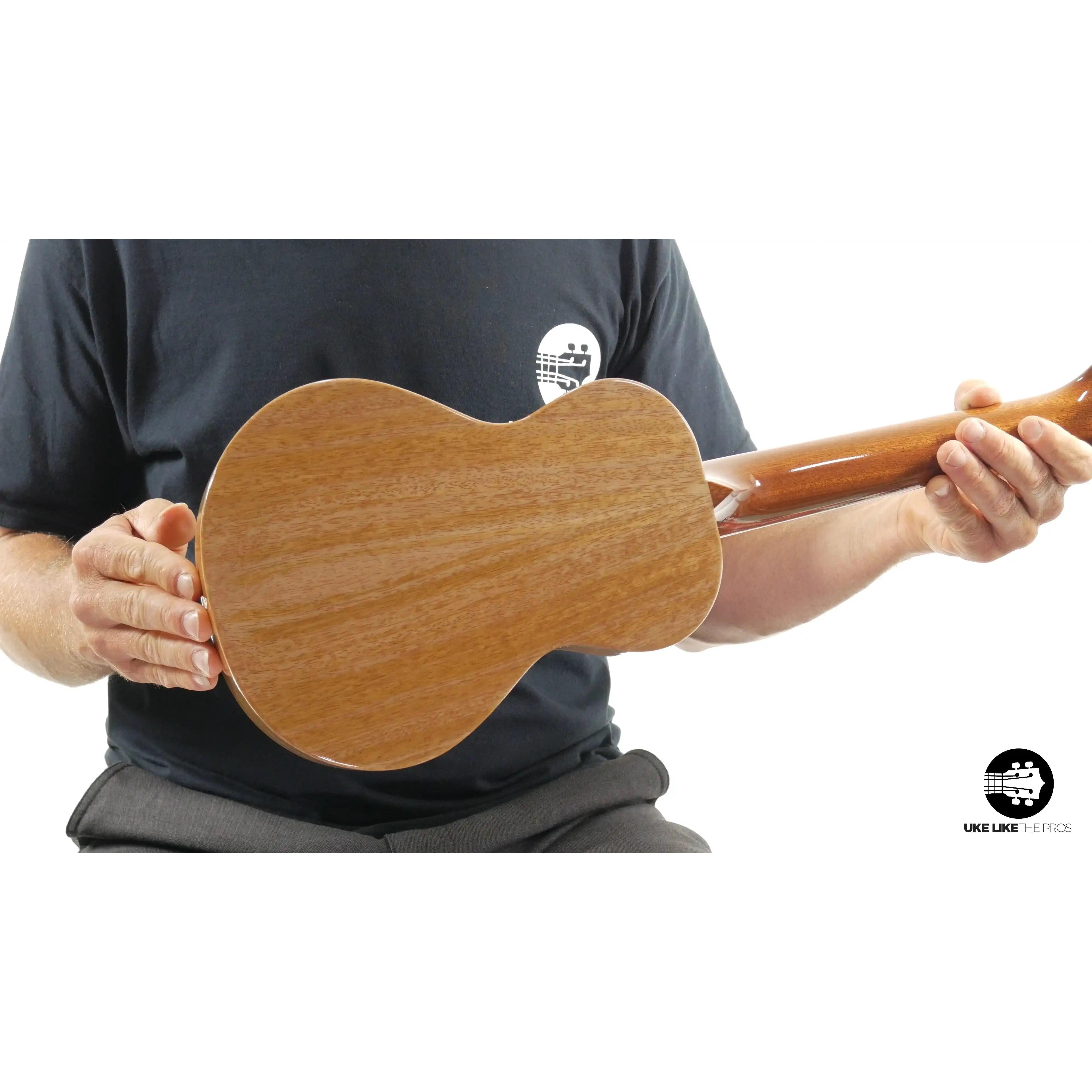 Back view of Rebel ukulele with natural wood finish, showcased at Terry Carter Music Store