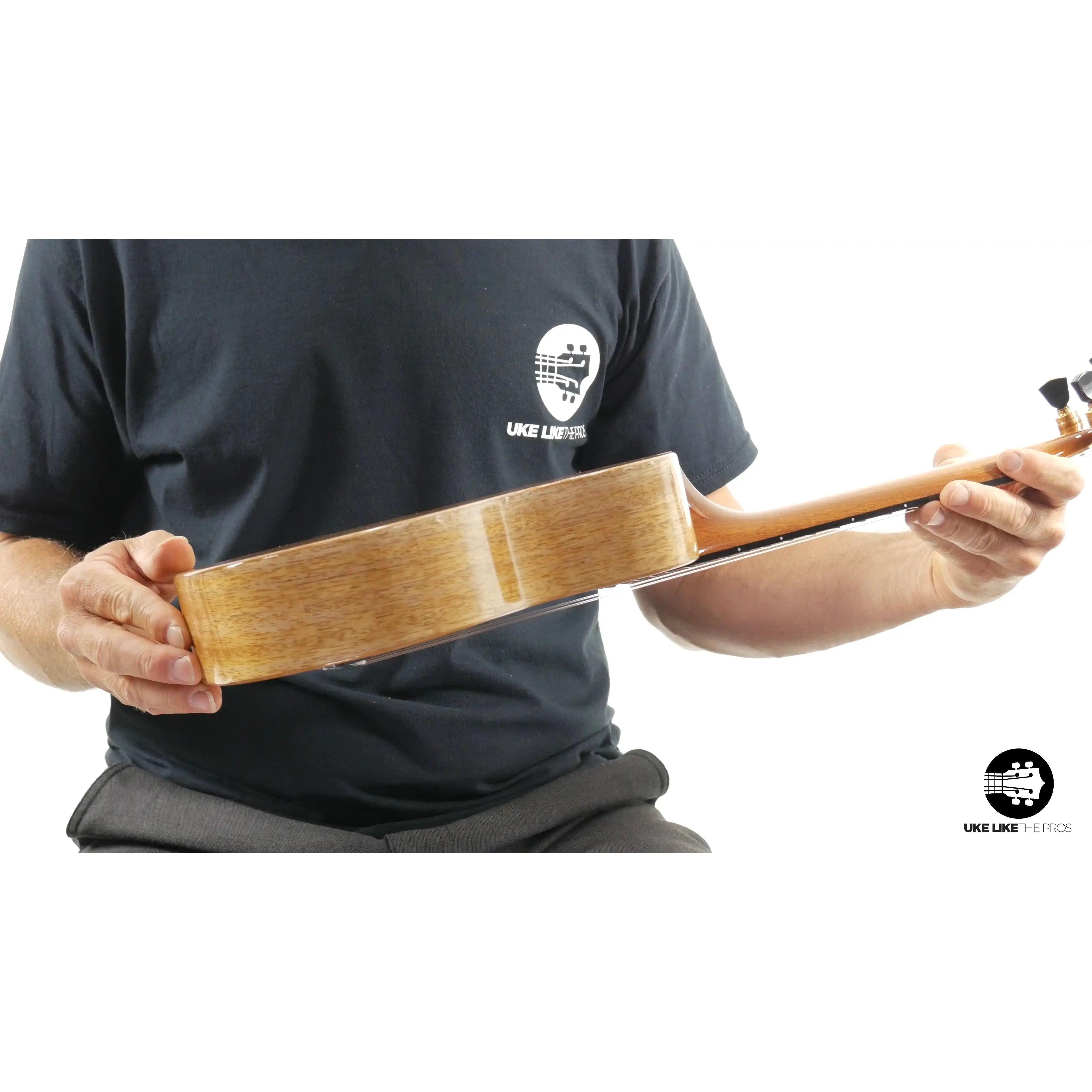 Romero Creations Rebel Double Creme ukulele side view, natural wood grain, Terry Carter Music Store
