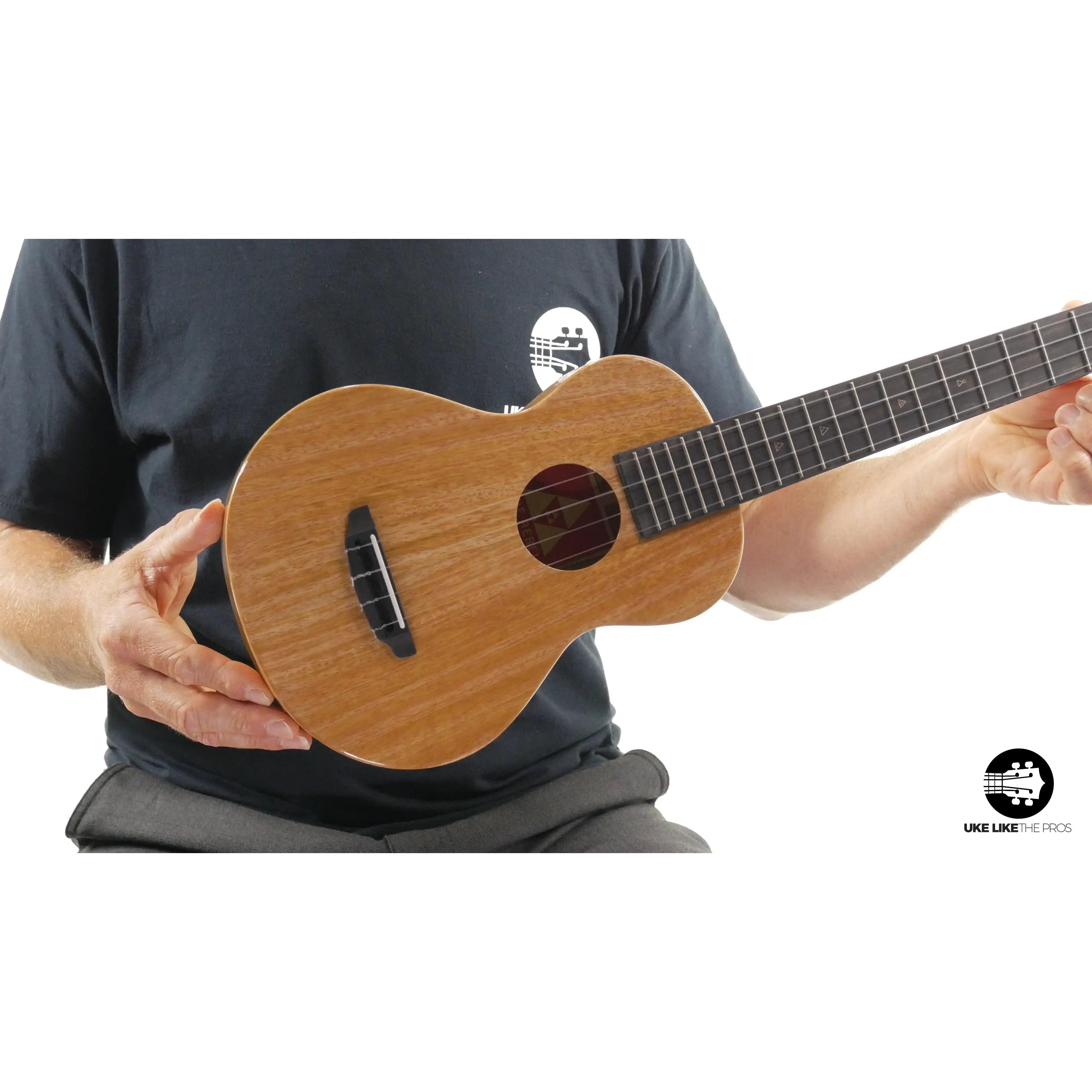 Rebel Double Creme ukulele with natural wood finish showcased at Terry Carter Music Store