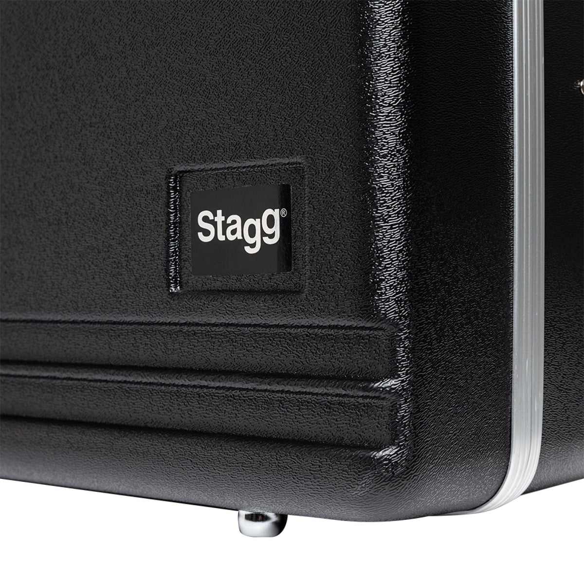 Stagg ABS-TS ABS case for tenor saxophone: close-up of the Stagg logo patch and corner foot