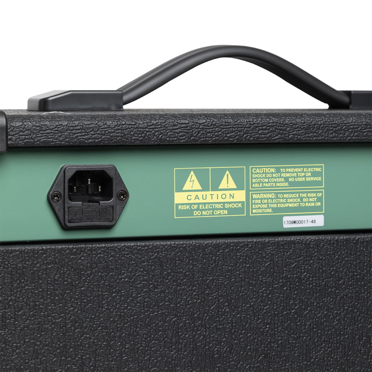Rear panel of the Stagg 20 GA amplifier with power inlet and caution label