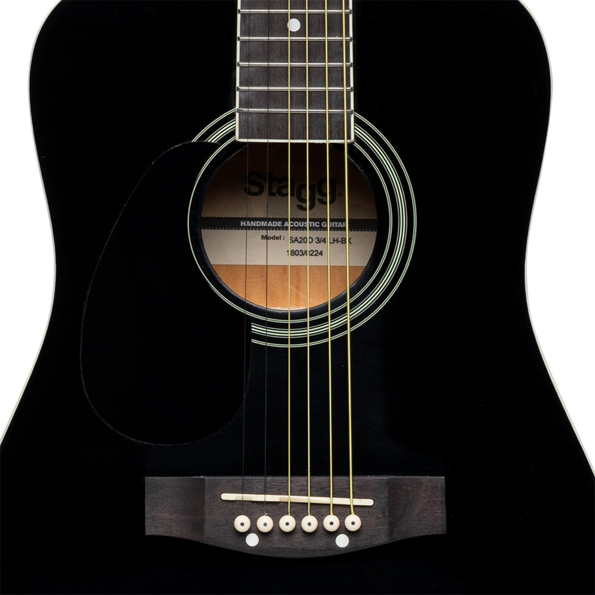 Close-up of the soundhole, rosette and bridge on the black Stagg SA20D 3/4 LH-BK acoustic guitar