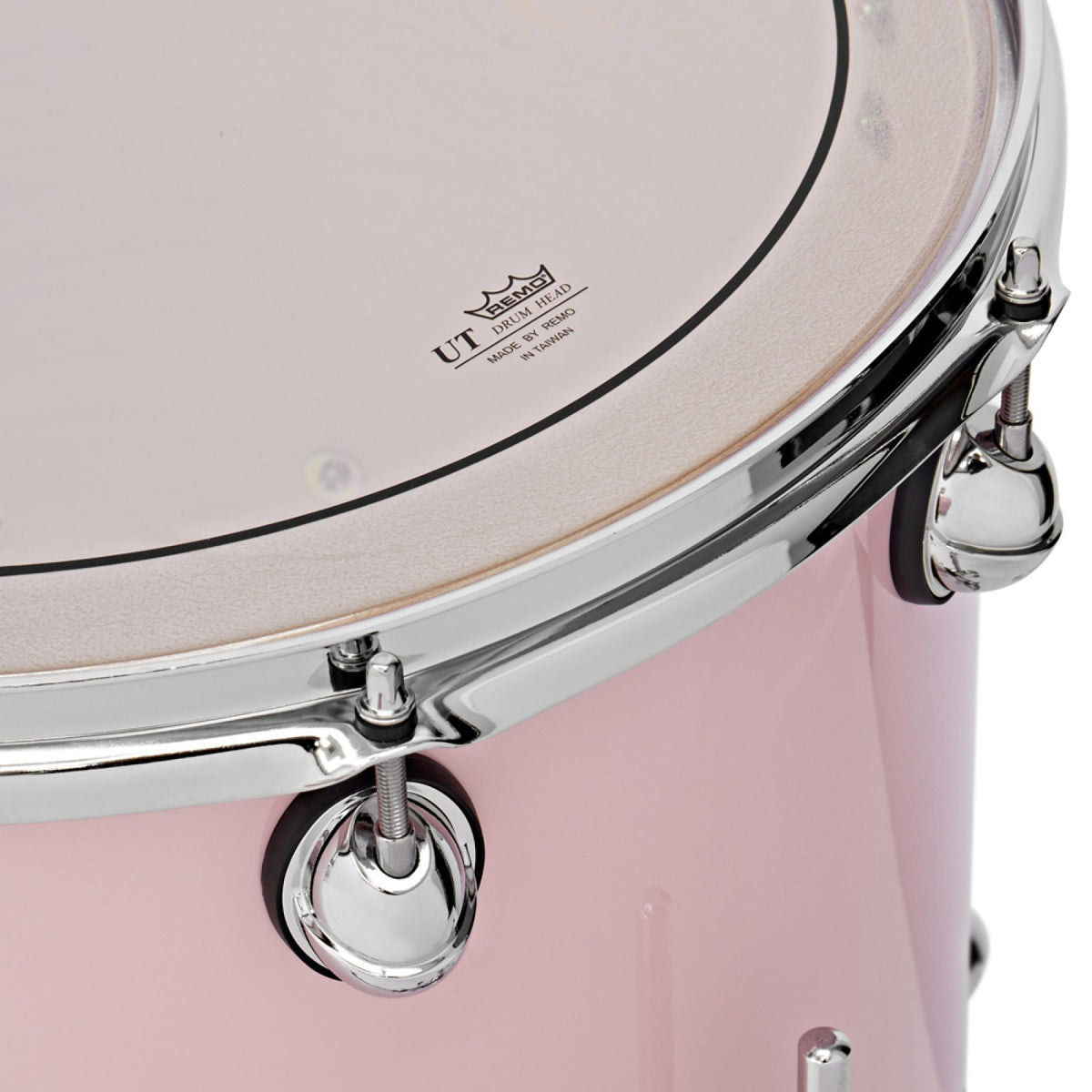 Close-up of the Remo Pinstripe UT drumhead and chrome hoop on a Pink Premier Genista Maple tom