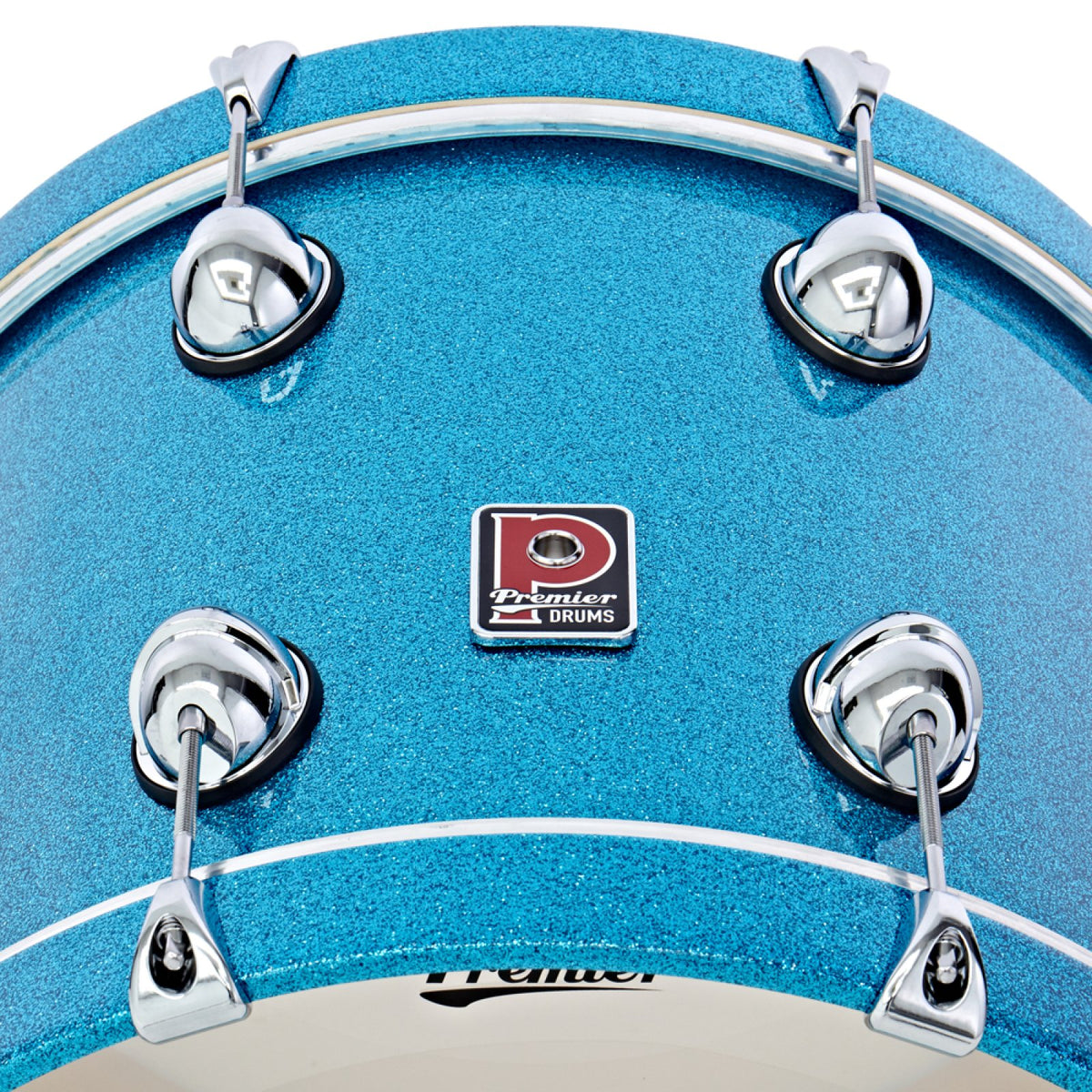 Close-up of the Premier badge and lugs on the bass drum of the Premier Genista Heritage 3-piece 18-inch shell pack in Aqua Sparkle