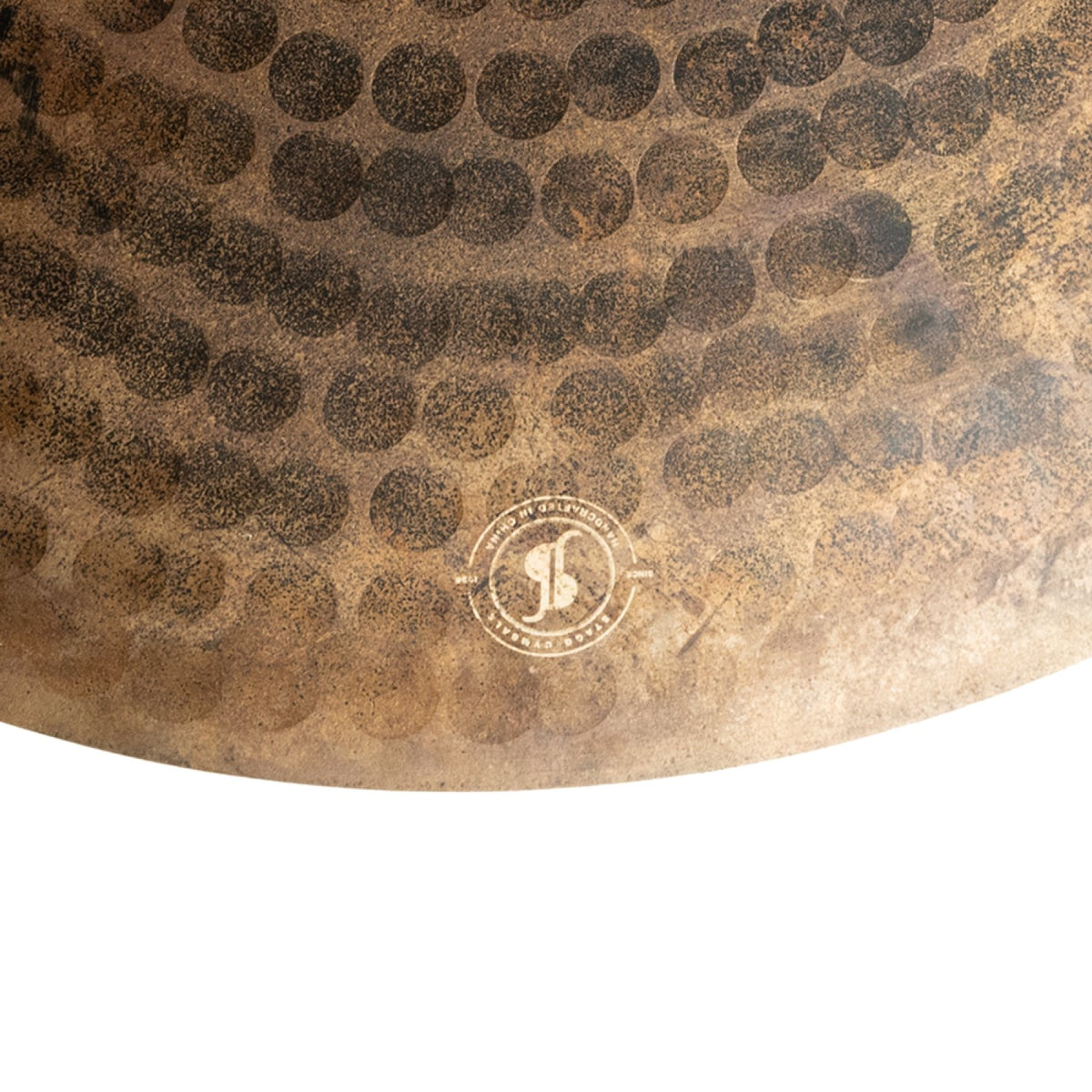 Close-up of the hammered surface and Stagg stamp on the Stagg MYRA Raw 20-inch ride cymbal