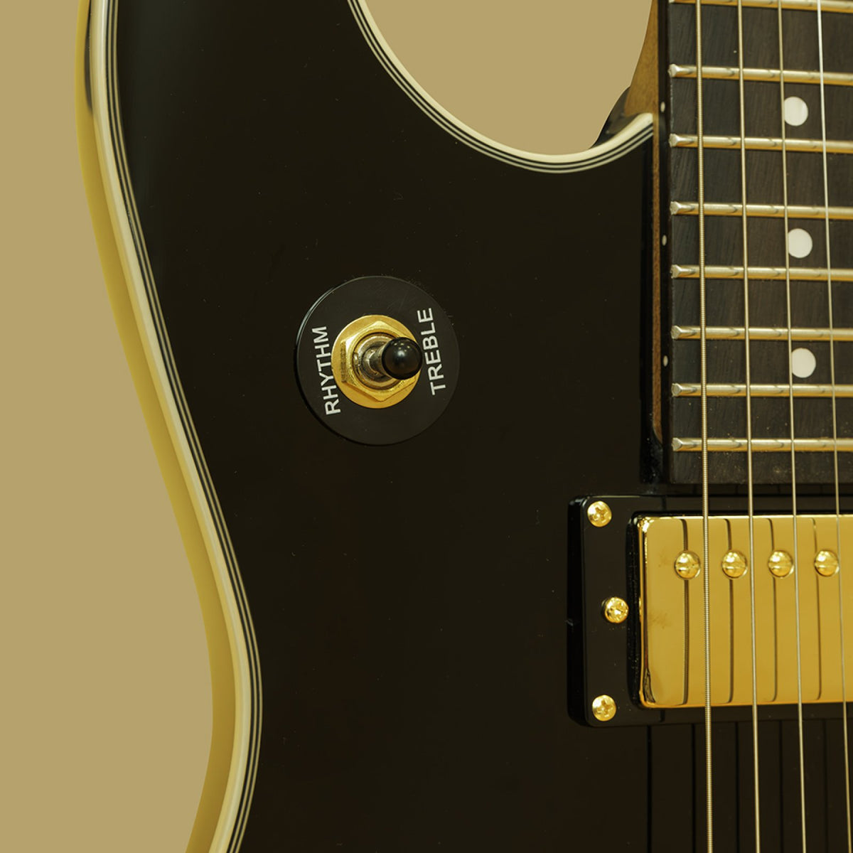 Close-up of the pickup selector switch and neck humbucker on the black Stagg 30th Anniversary Legacy guitar