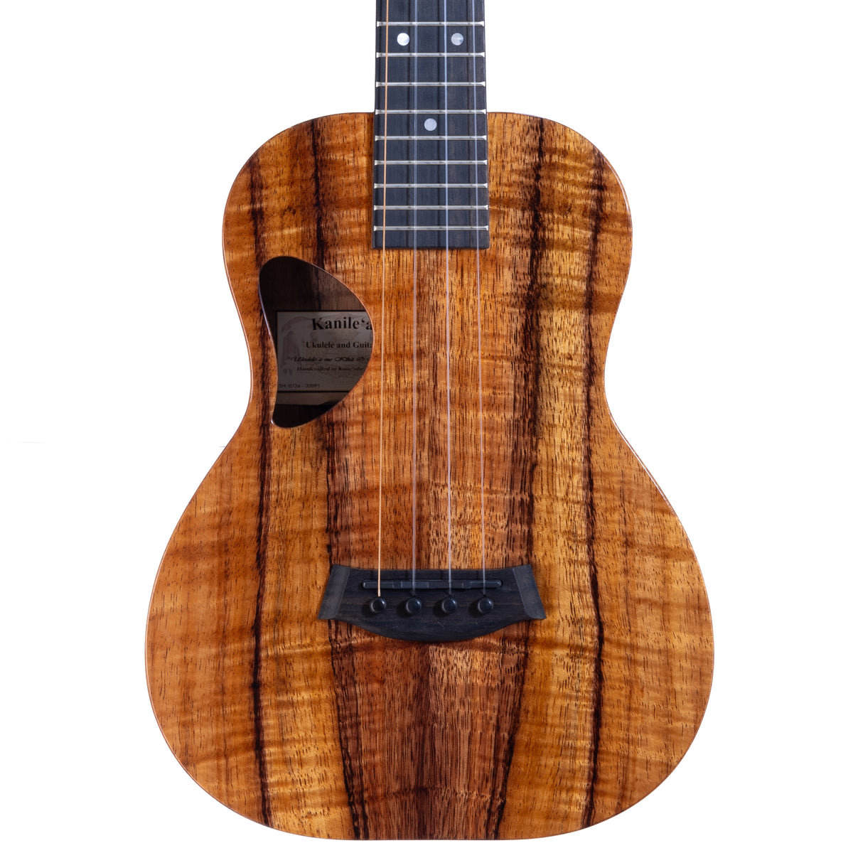 Upper bout of Kanile'a D-1 Pro 6-string tenor ukulele serial 30091 showing the koa top grain, D-shaped soundhole and oval side sound port