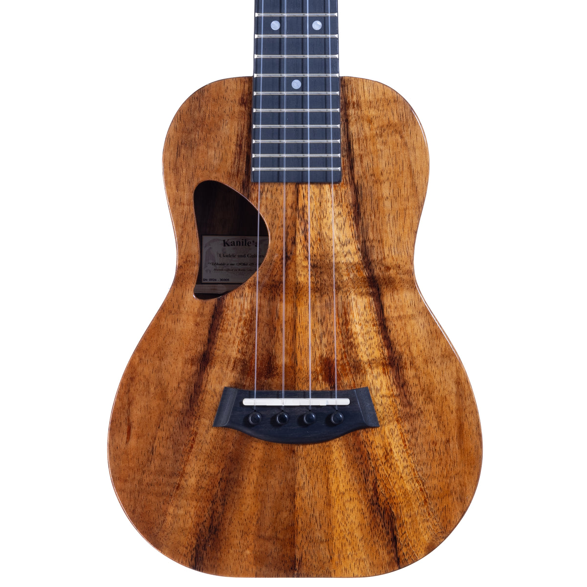 Upper bout of Kanile'a D-1 Deluxe concert ukulele serial 30305 showing the koa top grain and the label inside the soundhole