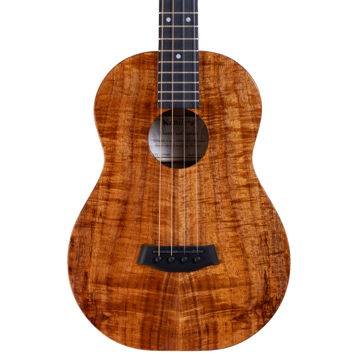 Upper bout of Kanile'a K-1 Pro baritone ukulele serial 29988 showing the koa top grain and the label inside the soundhole