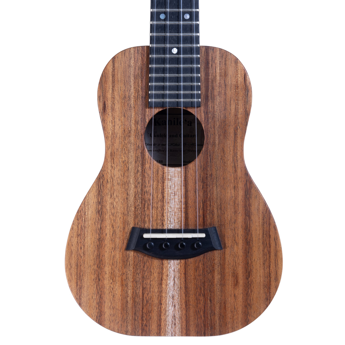 Upper bout of Kanile'a K-1 Natural concert ukulele serial 30188 showing the koa top grain and the label inside the soundhole