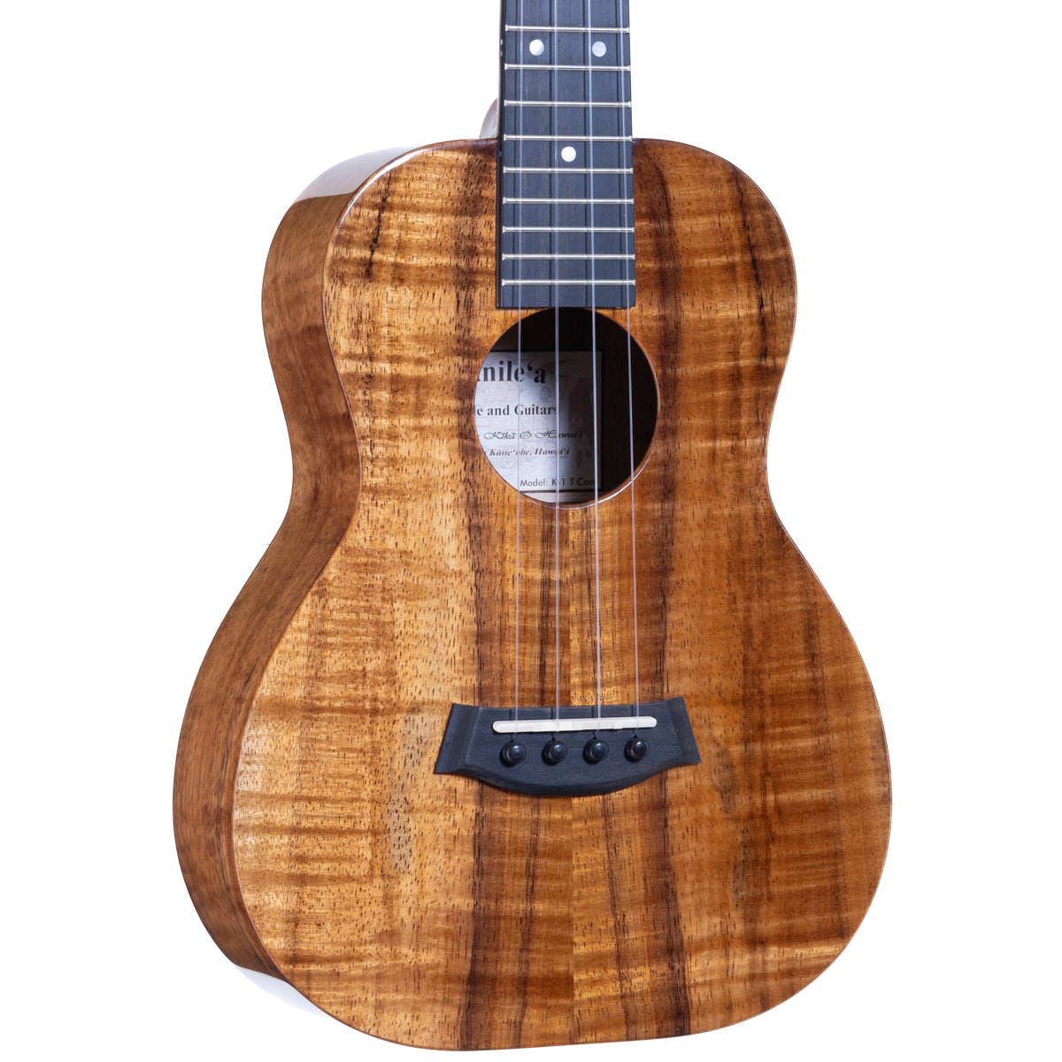 Close-up of the curly Hawaiian koa top, ebony bridge and soundhole on Kanile'a K-1 Deluxe tenor ukulele, serial 30298