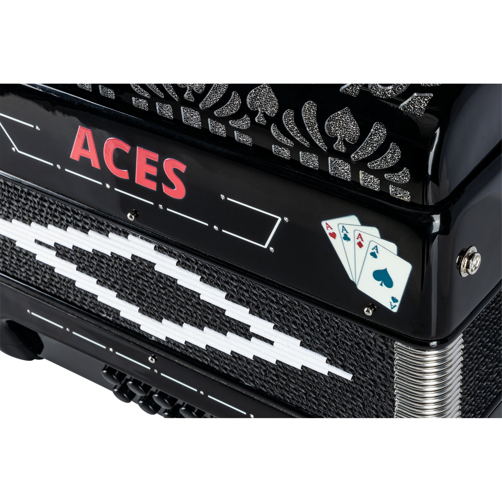 Close-up of a black piano keyboard with playing cards and the word 'ACES' in red on the side.