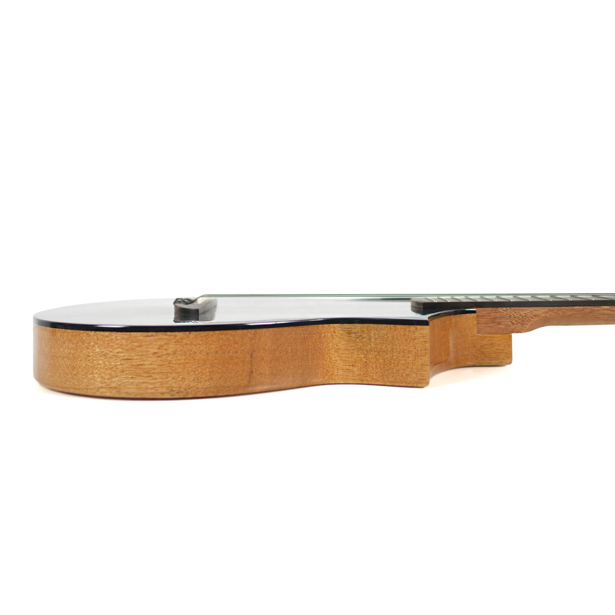 This side profile of the Flight Galaxy BL CE Baritone Ukulele highlights its solid mango sides, gloss finish, and cutaway neck joint.