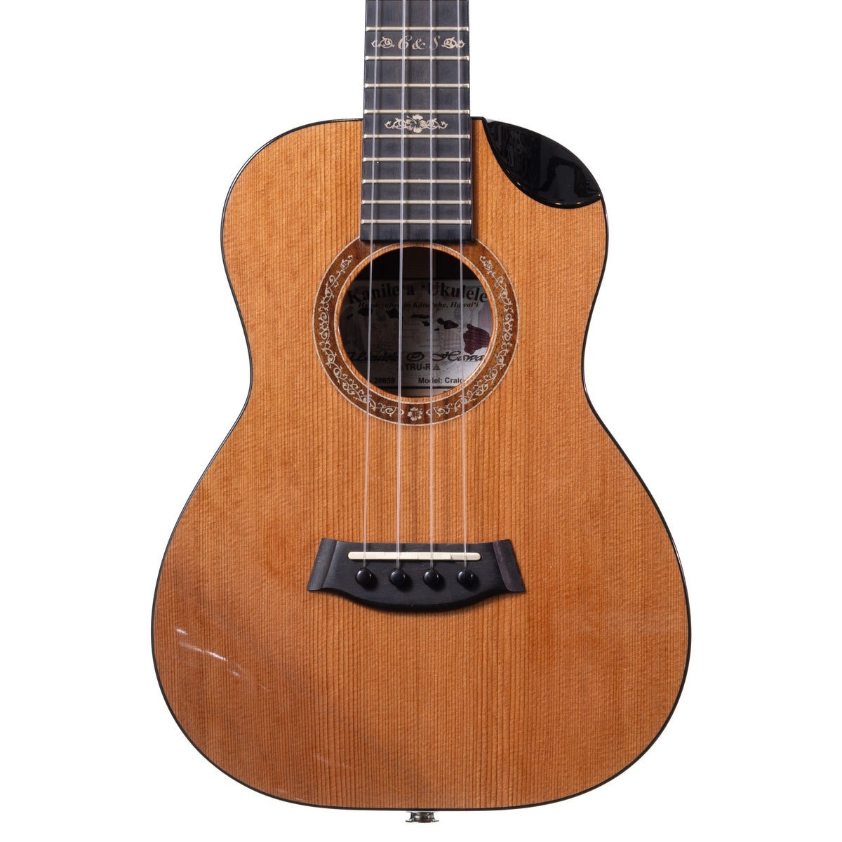 Example photo: an earlier Kanile'a Craig & Sarah tenor, serial 26659, body front with Alaskan rainbow cedar top and bevel cutaway