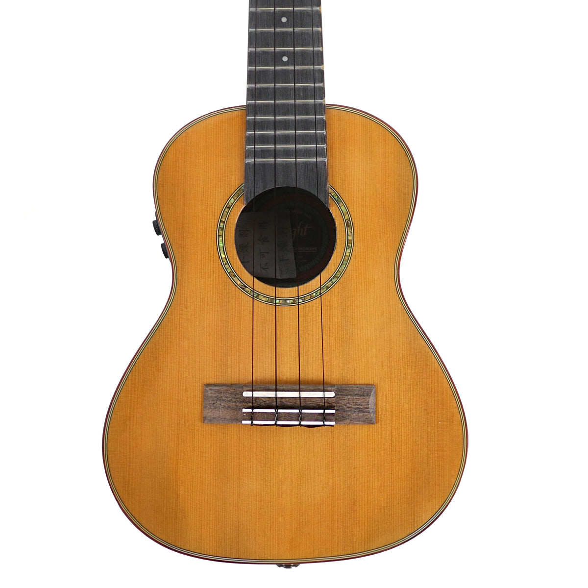 Flight Diana Soundwave Concert close-up highlights the solid cedar top, abalone rosette, purpleheart bridge, and classic soundhole.