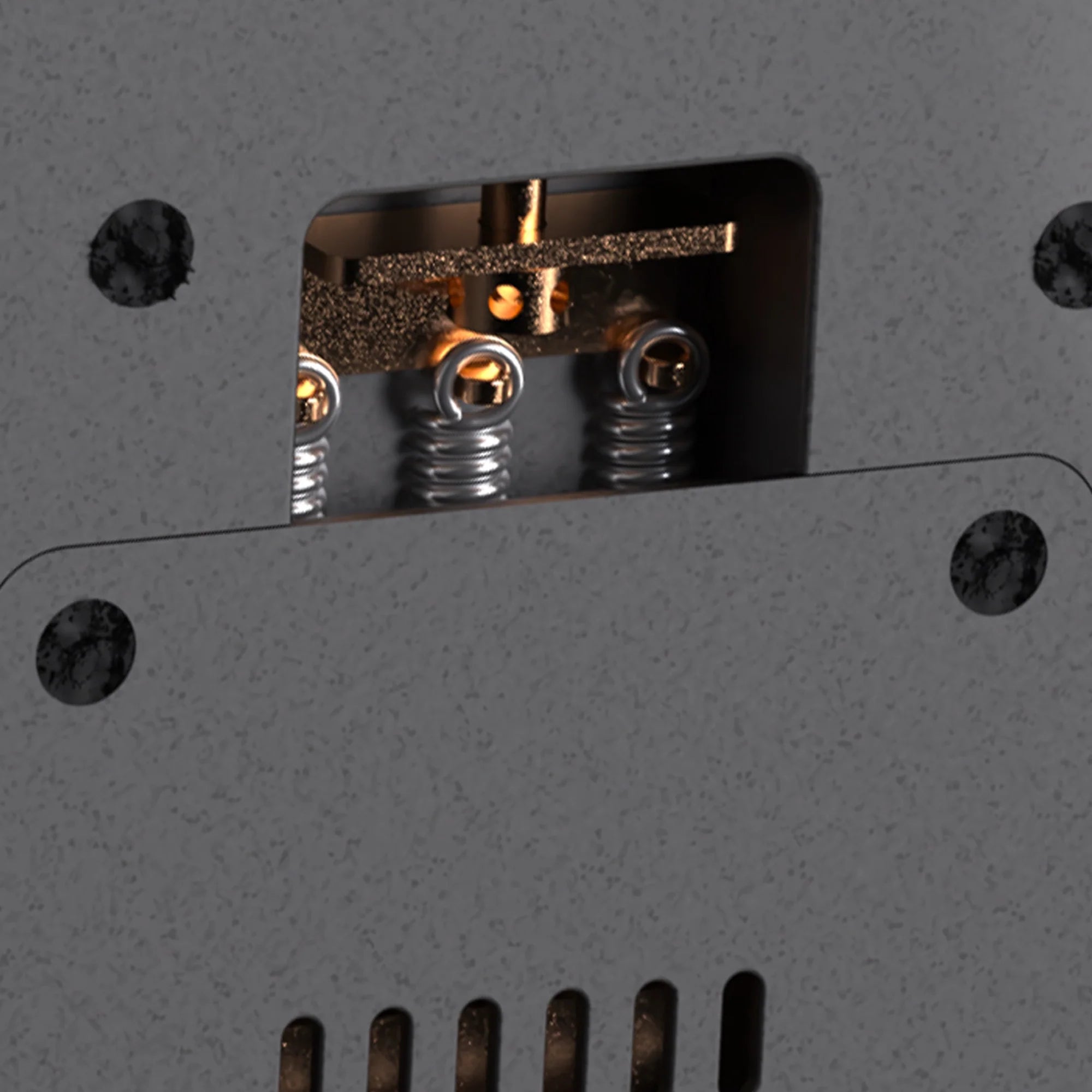 Close-up of a metallic component with springs on a gray background