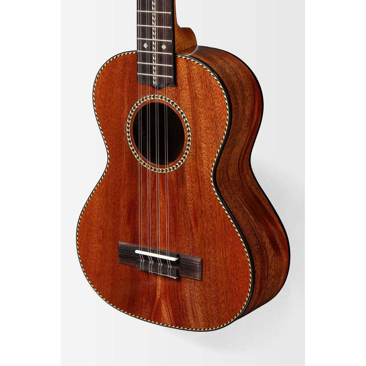 Angled view of the Kala KA-TARO-ASMH-T body showing rope purfling and satin mahogany sides