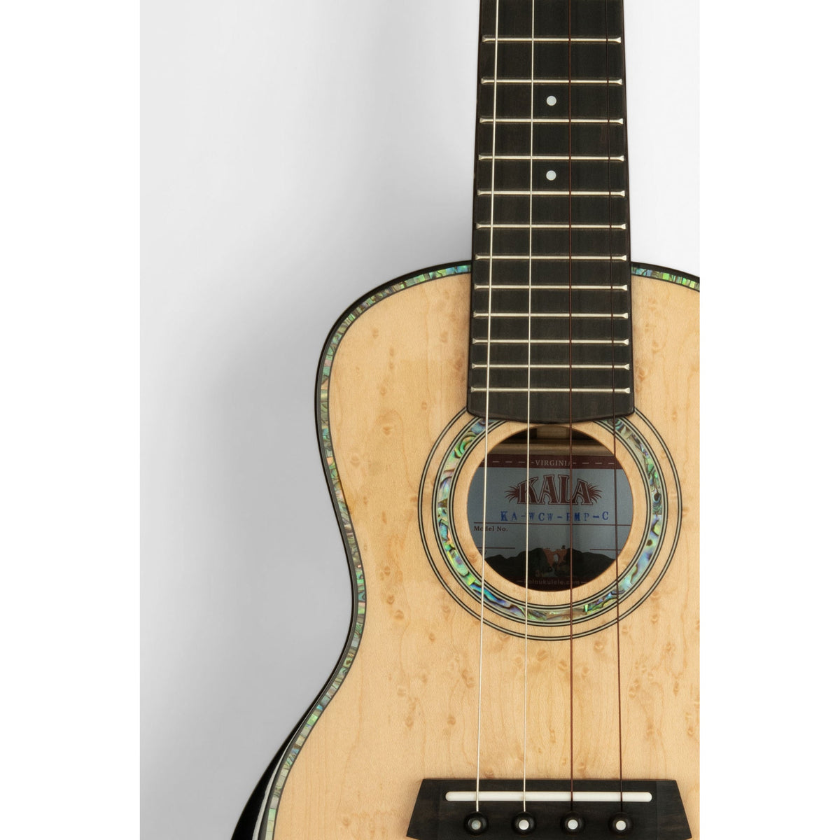 Kala KA-WCW-BMP-C body front close-up, pale solid birdseye maple top with abalone rosette and ebony bridge