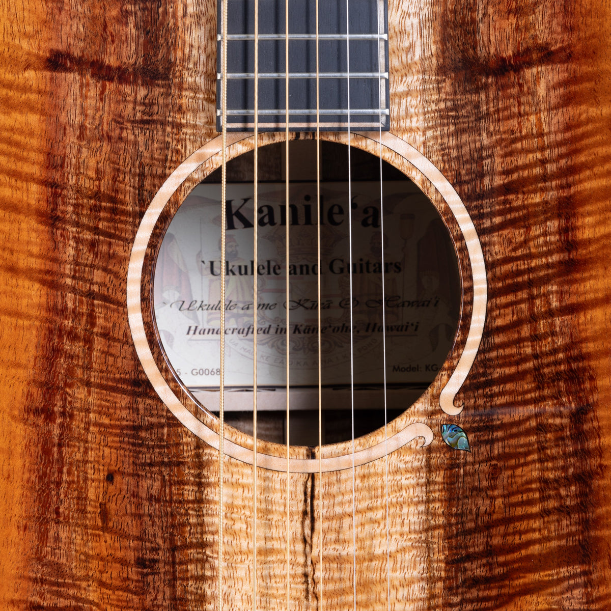 Example photo: an earlier Kanile'a KG-4 Pro, serial G0068, soundhole and abalone rosette close-up