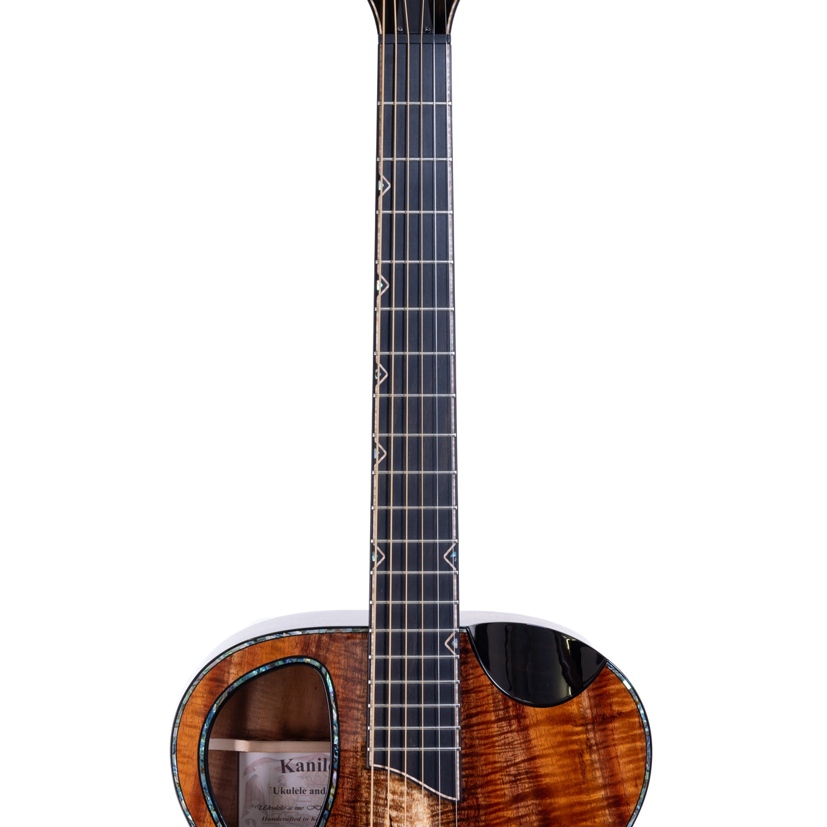 Example photo: an earlier Kanile'a KG-5, serial G0069, fretboard with Pāua abalone inlay