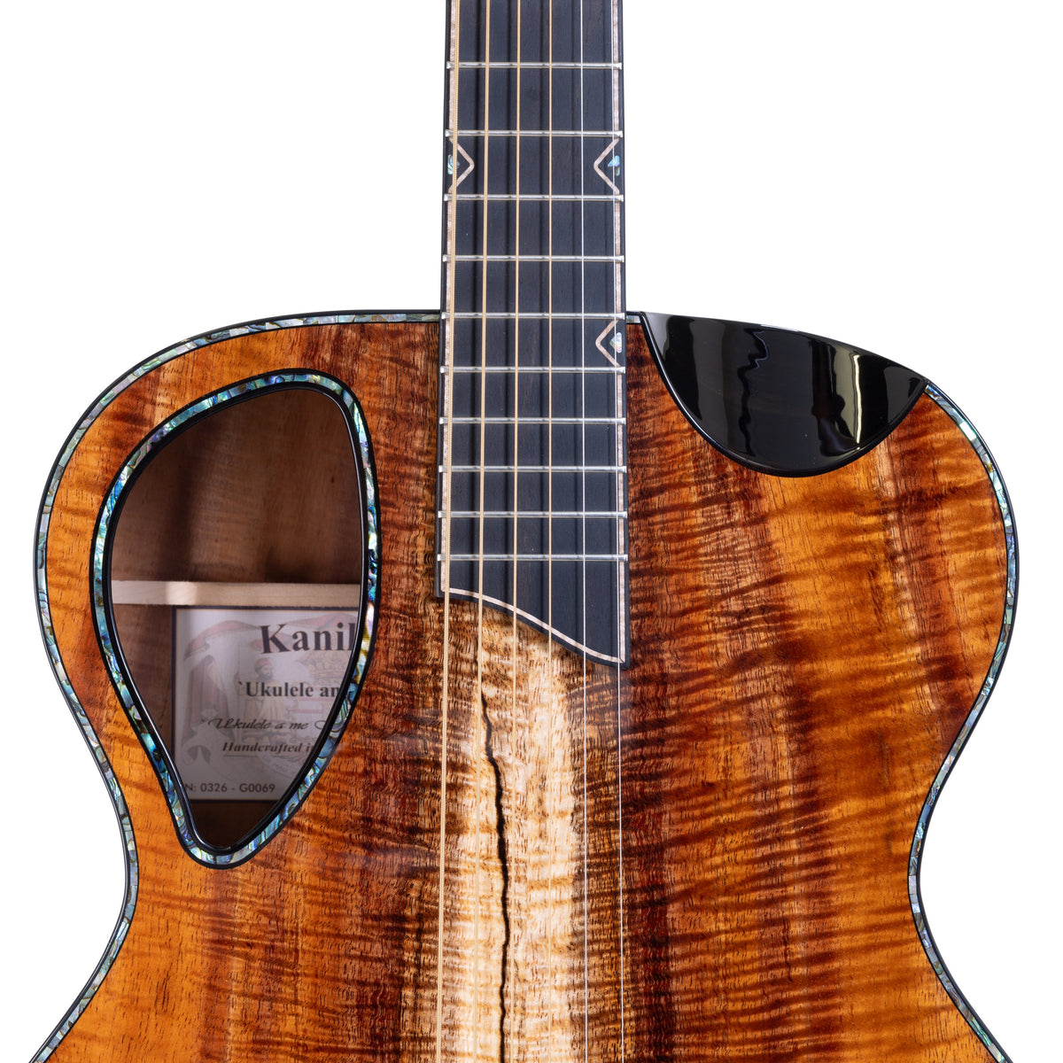 Example photo: an earlier Kanile'a KG-5, serial G0069, Komo ʻEkolu (Three Rings) side sound port
