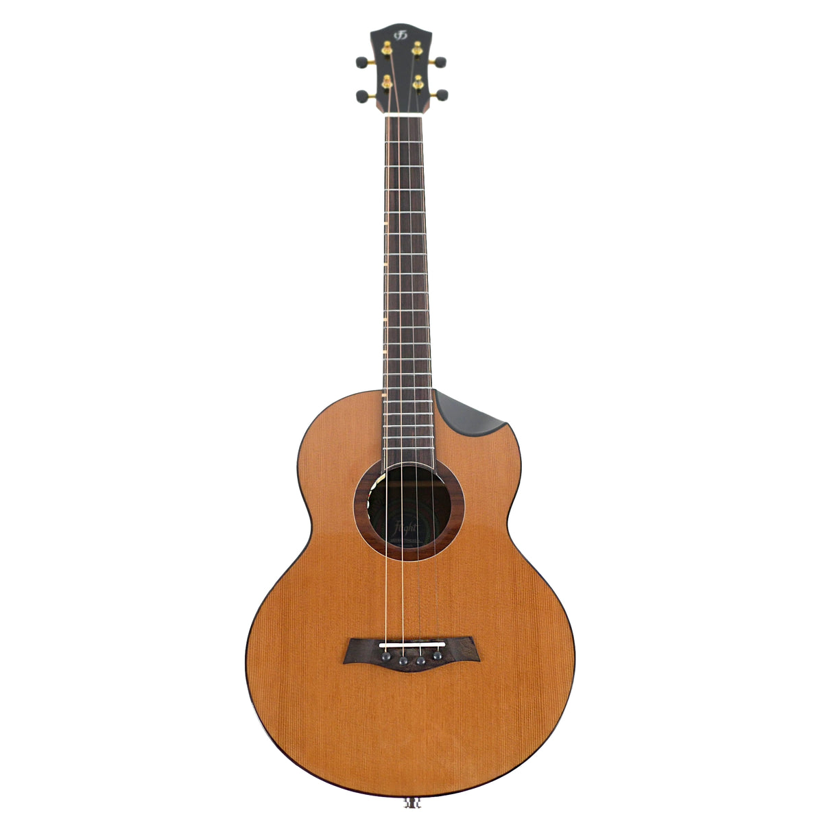 The full front view displays the solid cedar top, cutaway body, and long-scale neck of the Flight Lily Baritone.