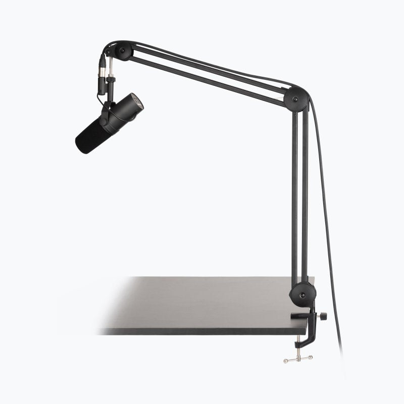 On-Stage MBS7500 boom arm extended over a desk with a microphone