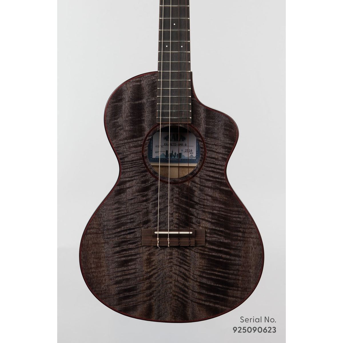Kala METD-BMR-B Metropolitan Deluxe baritone ukulele, serial 925090623, front view showing the solid mango top's dark figured grain and ebony rosette with red purfling