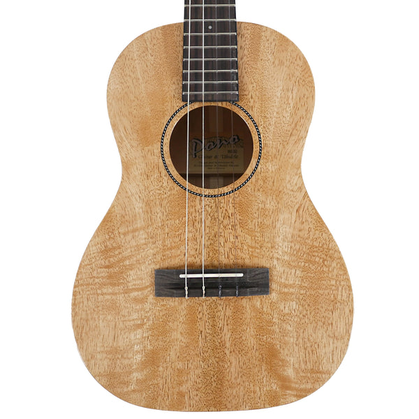 A close-up studio shot of a Pono MGBD ukulele front, showing a solid mango wood body with a visible 'Pono' logo on the soundboard.