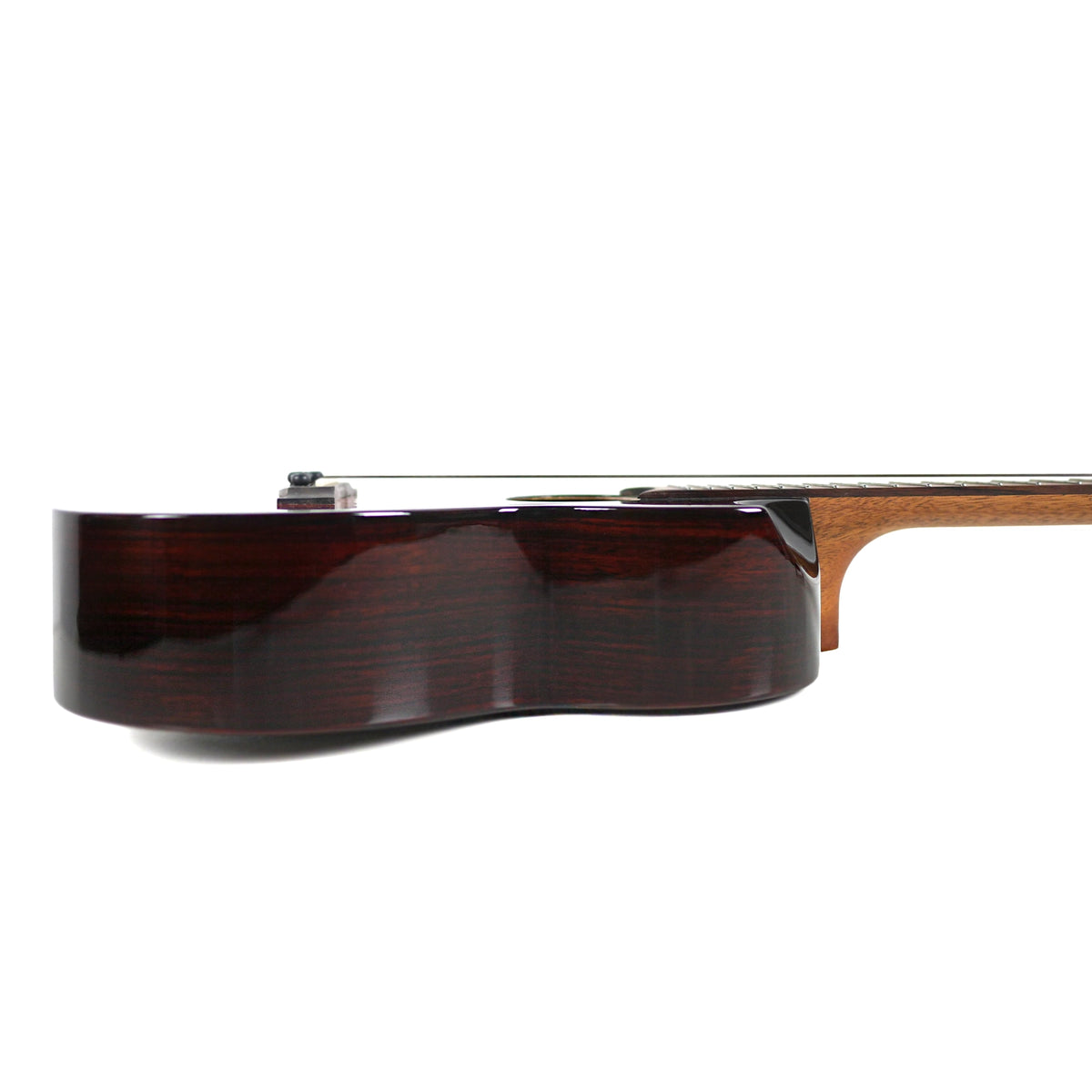 The side profile displays the solid rosewood sides and glossy finish of the Flight Navigator Tenor.