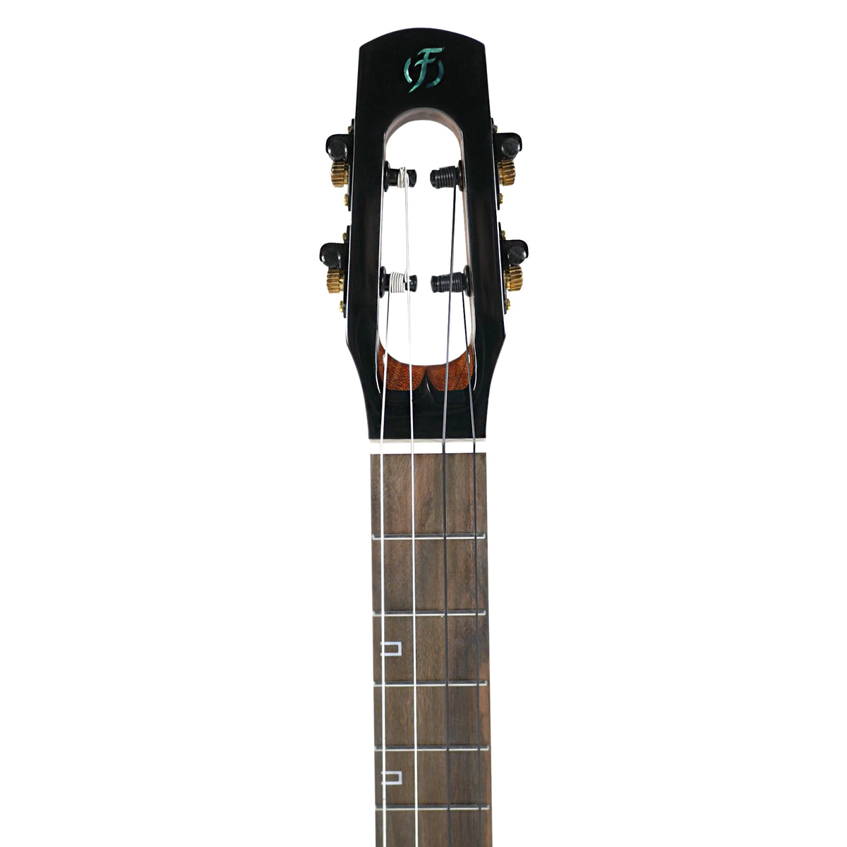 The headstock close-up displays the unique slotted design and tuning hardware of the Flight Nighthawk Baritone.
