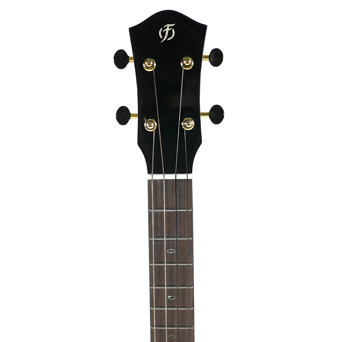 The headstock close-up displays the unique design, gold tuning hardware, and bone nut of the Flight Nomad Baritone.