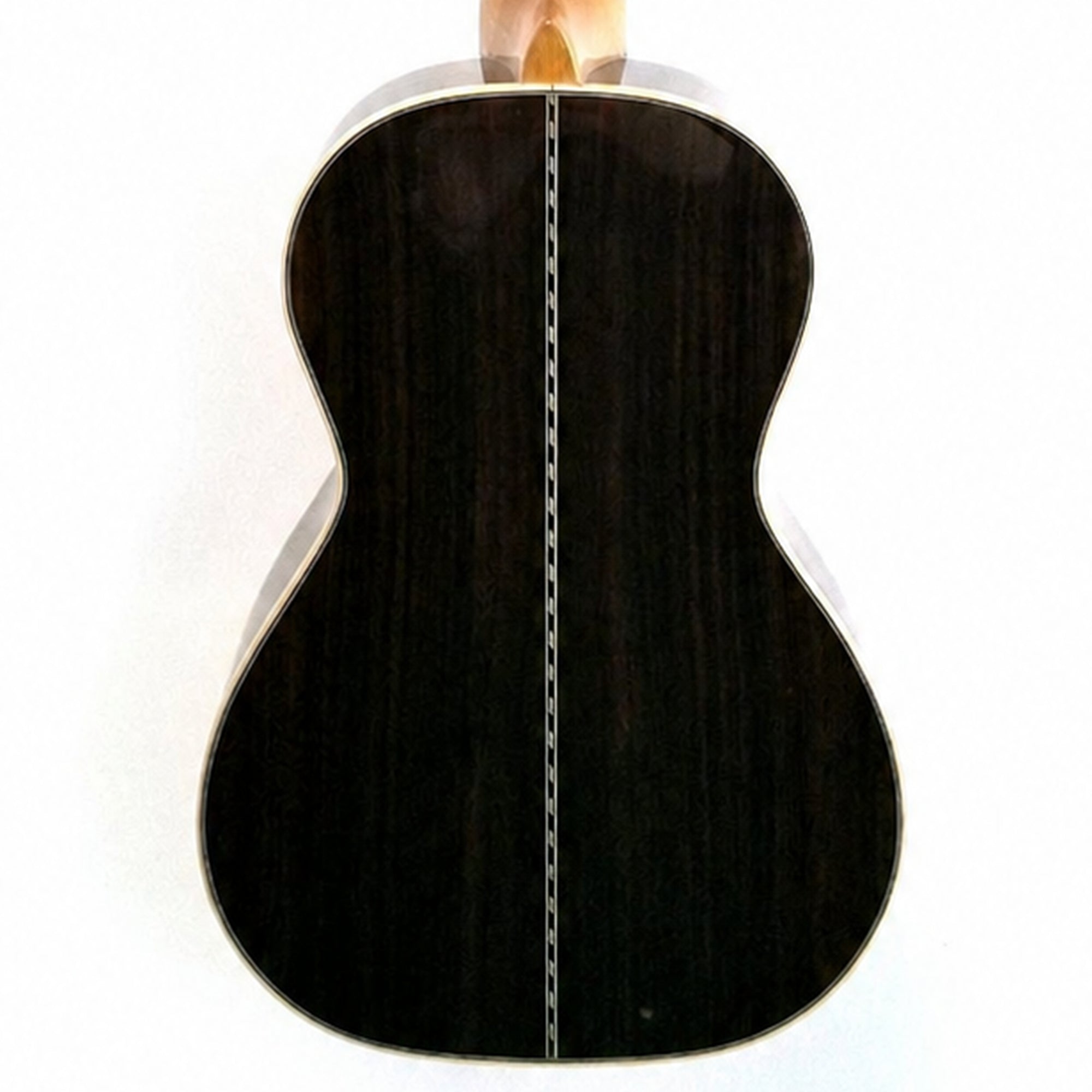 The back of a Ohana CK-42, showing a glossy black finish and a silver metal bridge, photographed against a plain white background.