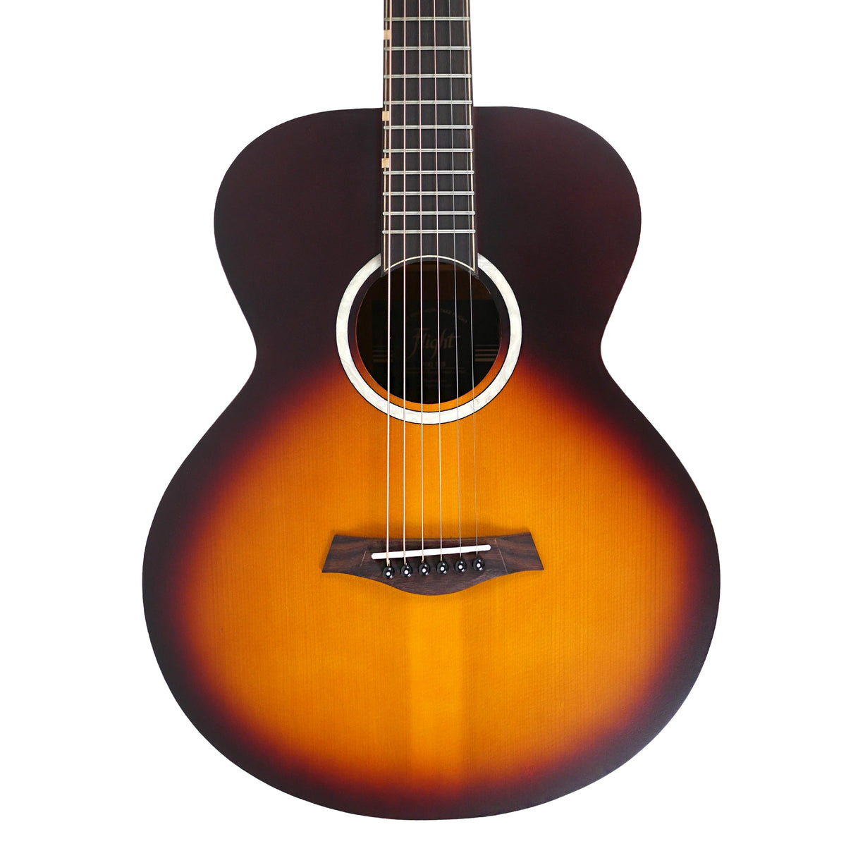 The close-up highlights the sunburst solid spruce top, white acrylic rosette, and rosewood bridge of the Flight PIXI TSB.