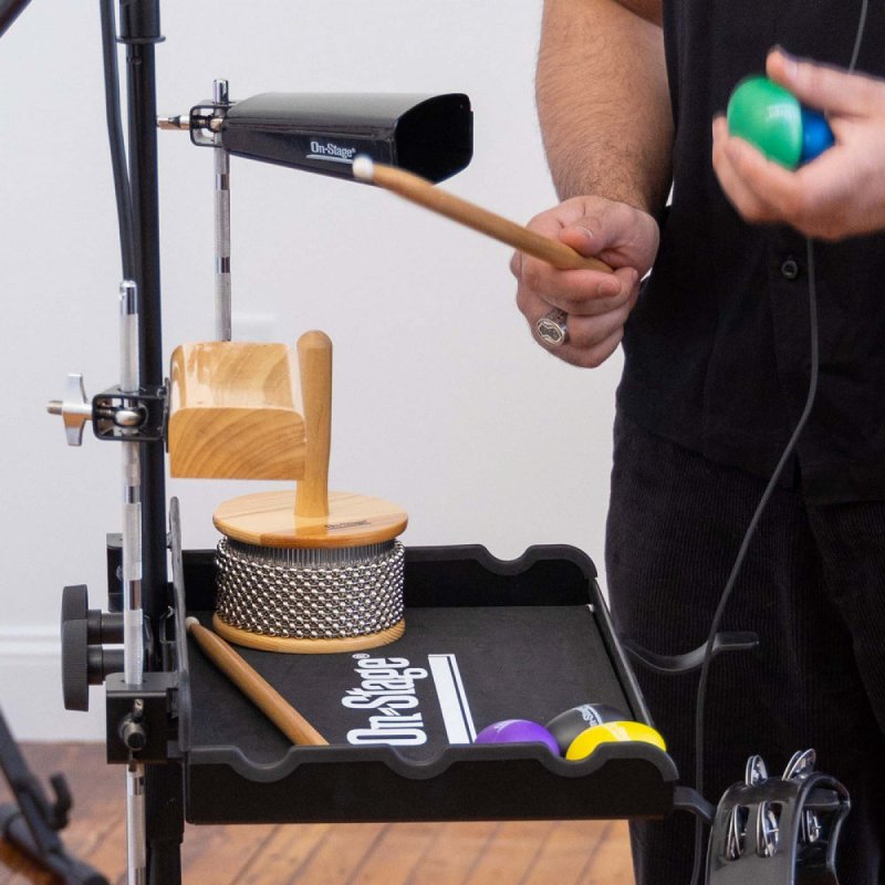 Drummer playing a cowbell mounted on an On-Stage PRS1010 rod