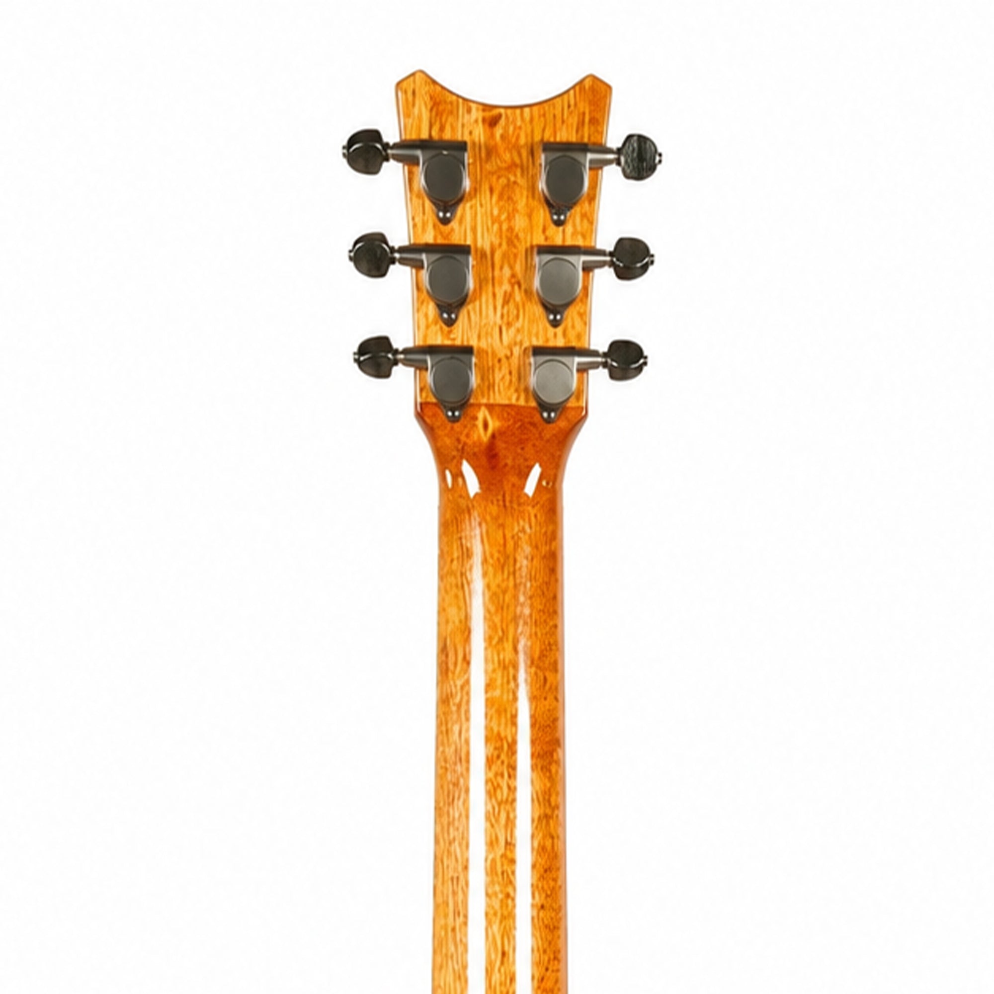 Close-up of the headstock of a six-string acoustic guitar, showing the glossy orange-brown wood grain and black tuning pegs against a white background.