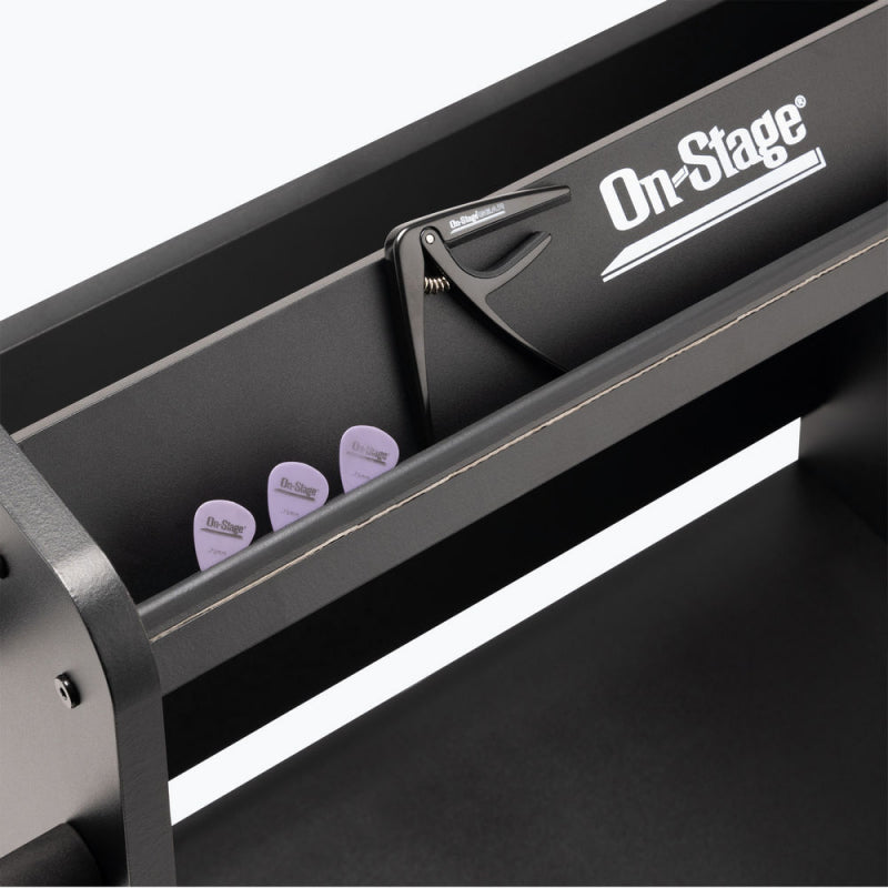 Accessory tray on top of the On-Stage GWS5000B holding picks and a capo