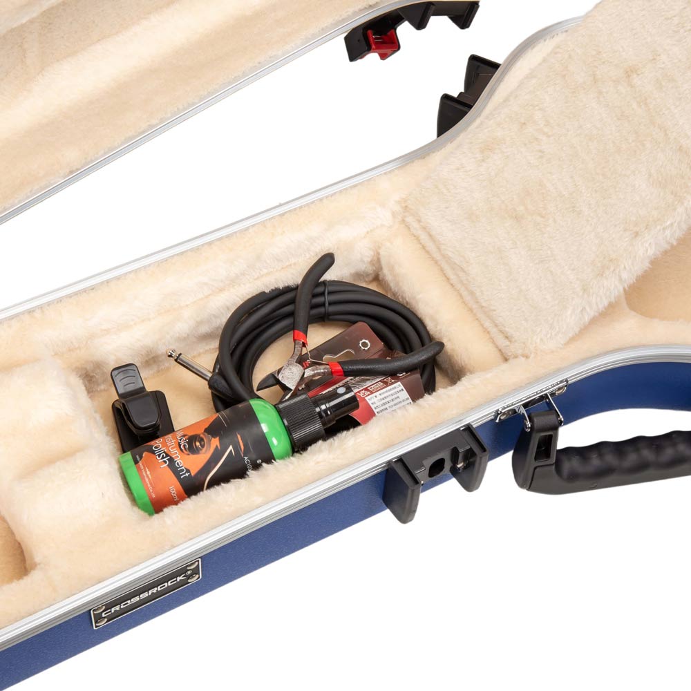 CRA980LVB neck accessory compartment holding a cable, clip-on tuner, pliers, and instrument polish.